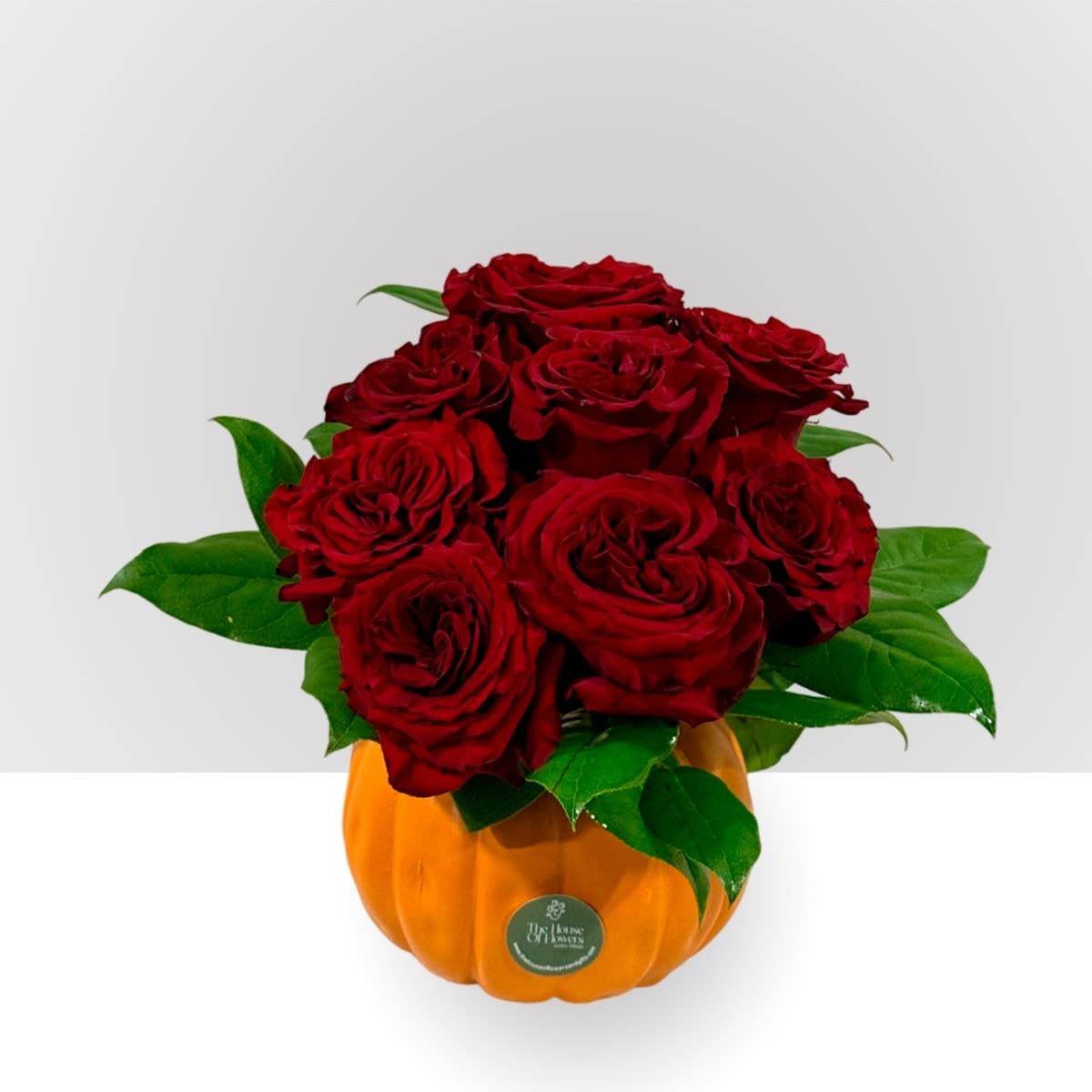 Autumn roses by The House of Flowers - Turn your fall into a romantic and joyful time with red roses. The presentation is on a ceramic pumpkin base.