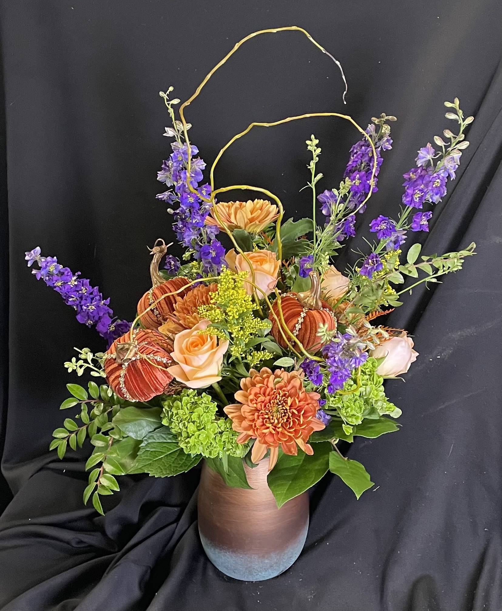 Autumn Elegance - Elegant flowers in a patinated copper container accented with Mark Roberts bedazzled pumpkins.  A seasonal day-brightener guaranteed to lift any spirit!