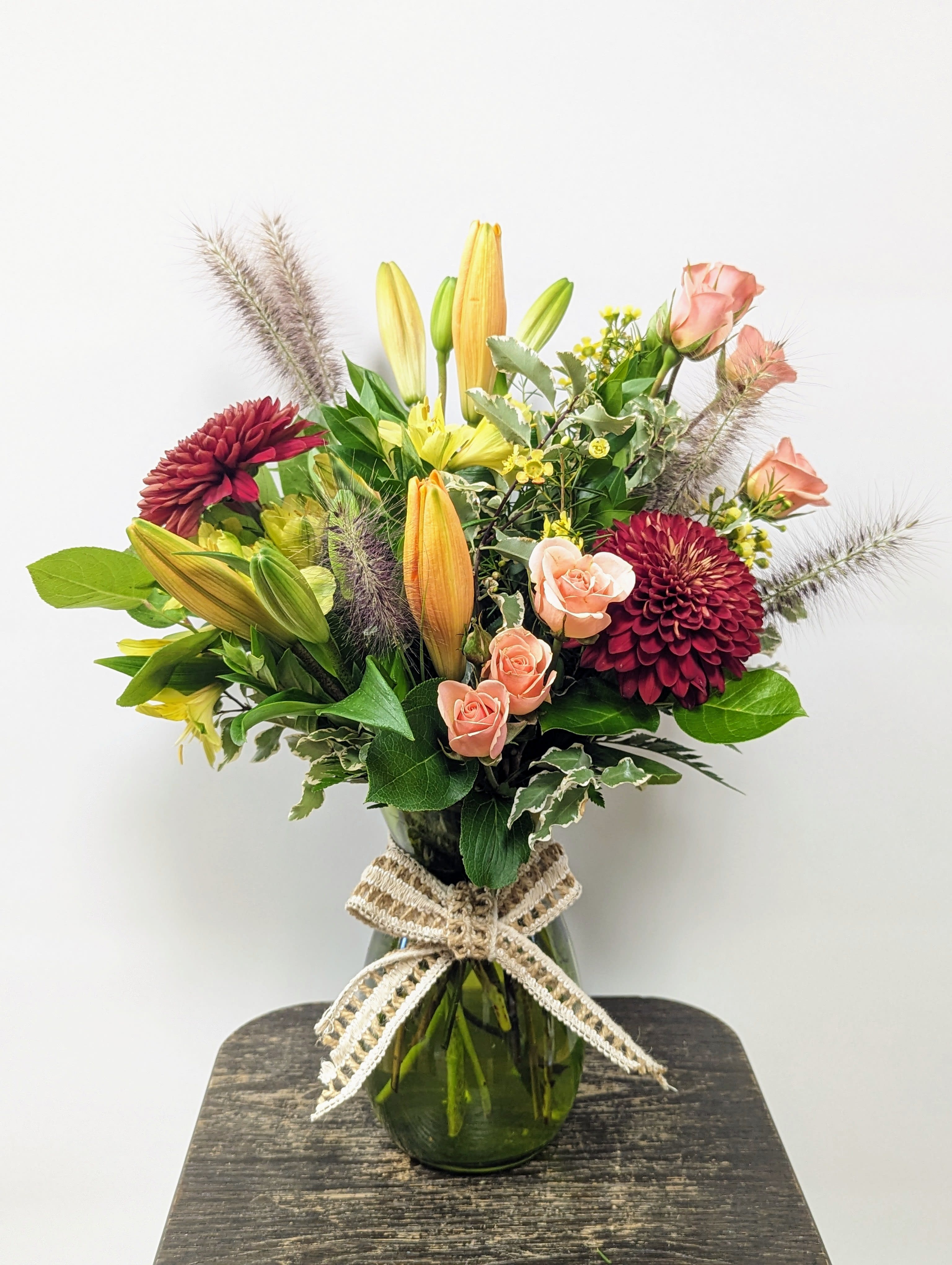 In Awe of Fall! - Jump into fall with this beautiful seasonal vase arrangement! Filled with some of our favorite blooms, this is the perfect arrangement to send for any occasion!   Vases may vary in color: Green, Orange, Red, or Berry