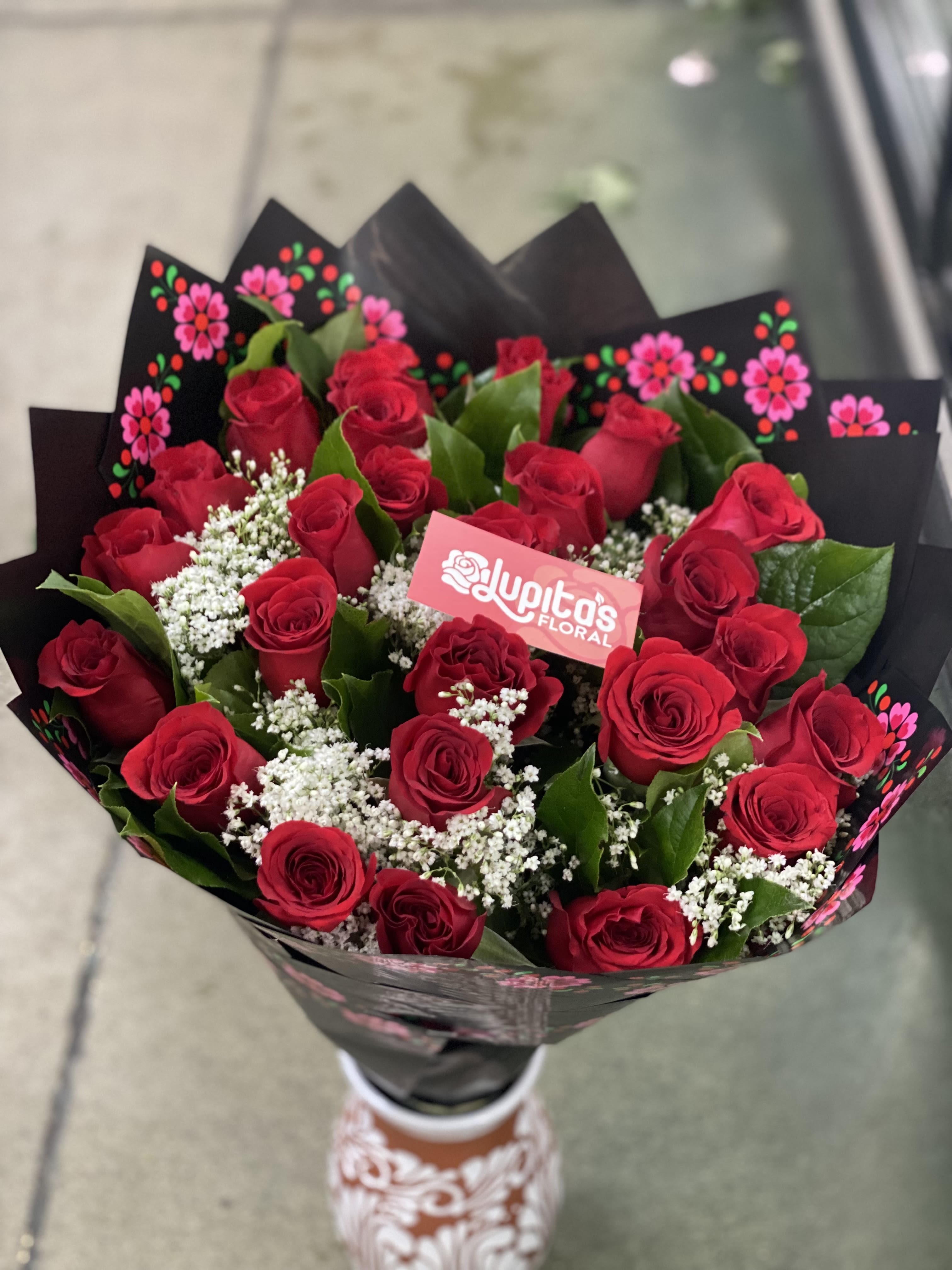 Mexican Wrapped Roses &amp; Greenery - 24 Roses Standard (Photo). 36 Roses Deluxe. 48 Roses Premium.  You can request change in color during checkout. 