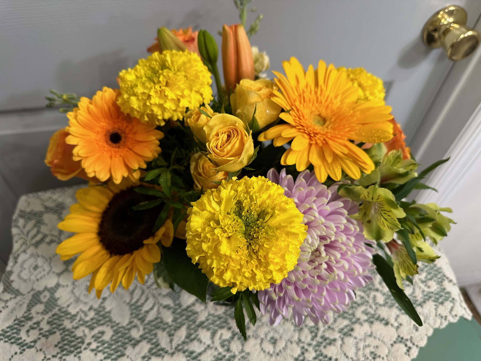 Orange & Yellow Arrangement Orange & Yellow Arrangement - Sunflowers, Gerbera Daisies, Marigold(Seasonal), Asiatic Lilies, Roses, Fancy Greens