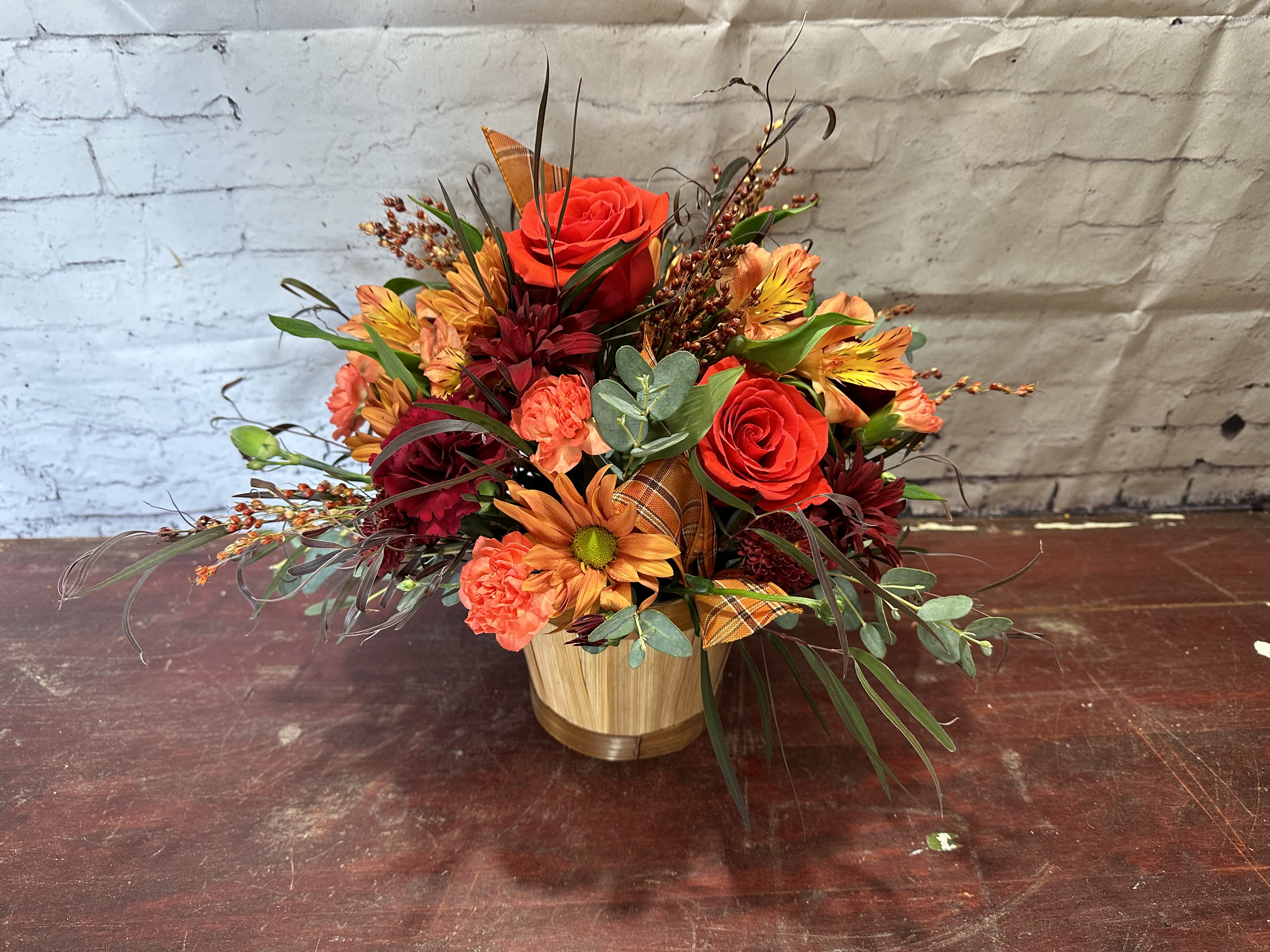 Hayride Hayride - Wood container with burgundy and orange fall flowers