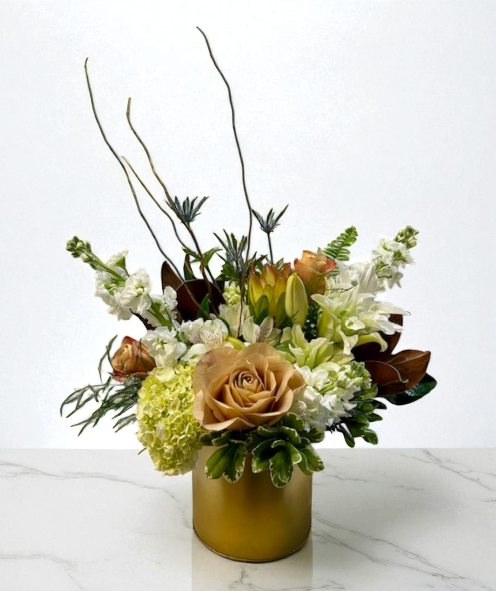 Golden Grove - A modern composition in tones of white and gold, blending natural texture with luminous elegance. Golden Grove evokes warmth, balance, and sophistication — a timeless design that brings refined beauty to any occasion.