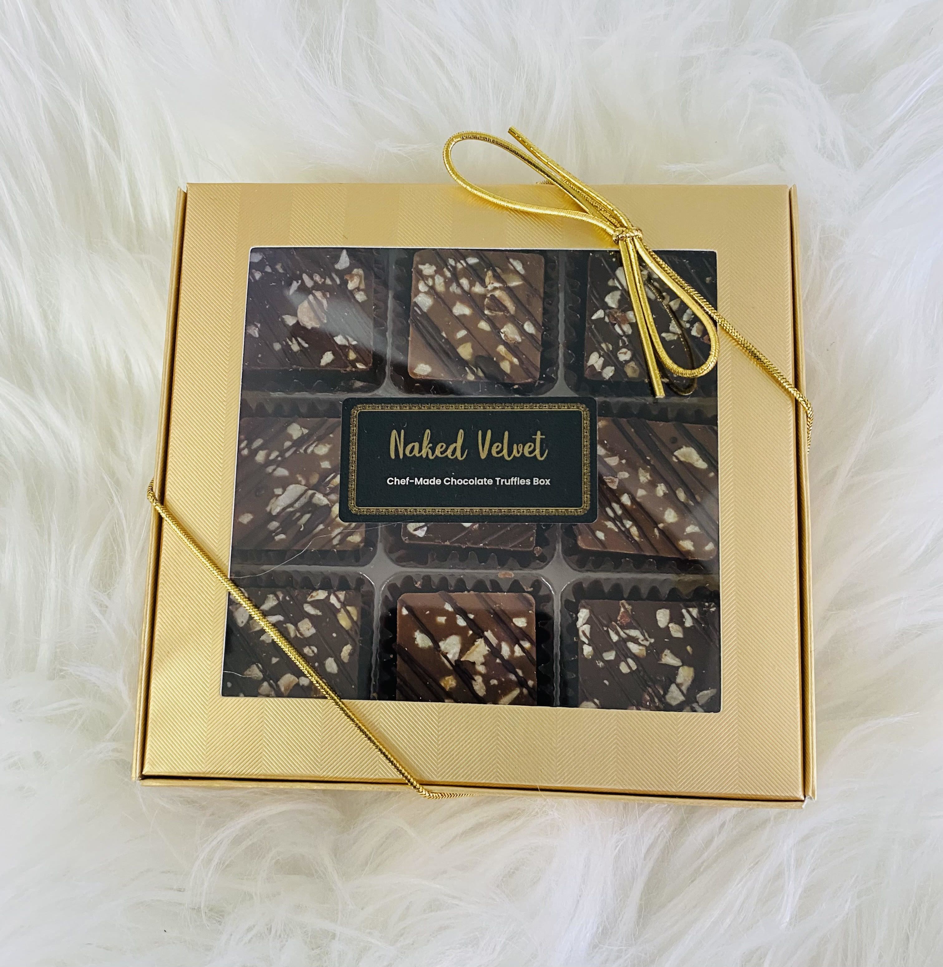 Naked Velvet Truffles Naked Velvet Truffles - The world's creamiest dark and milk chocolate hazelnut truffles with roasted hazelnuts.