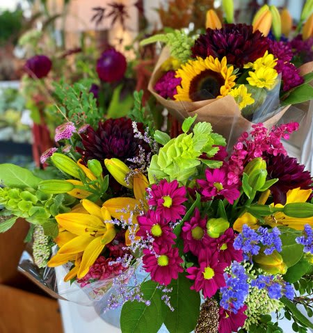 Mixed Fall Bouquets Mixed Fall Bouquets - A fresh assorted blend of fall blooms arranged with mixed greenery into a hand-tied cut bouquet.