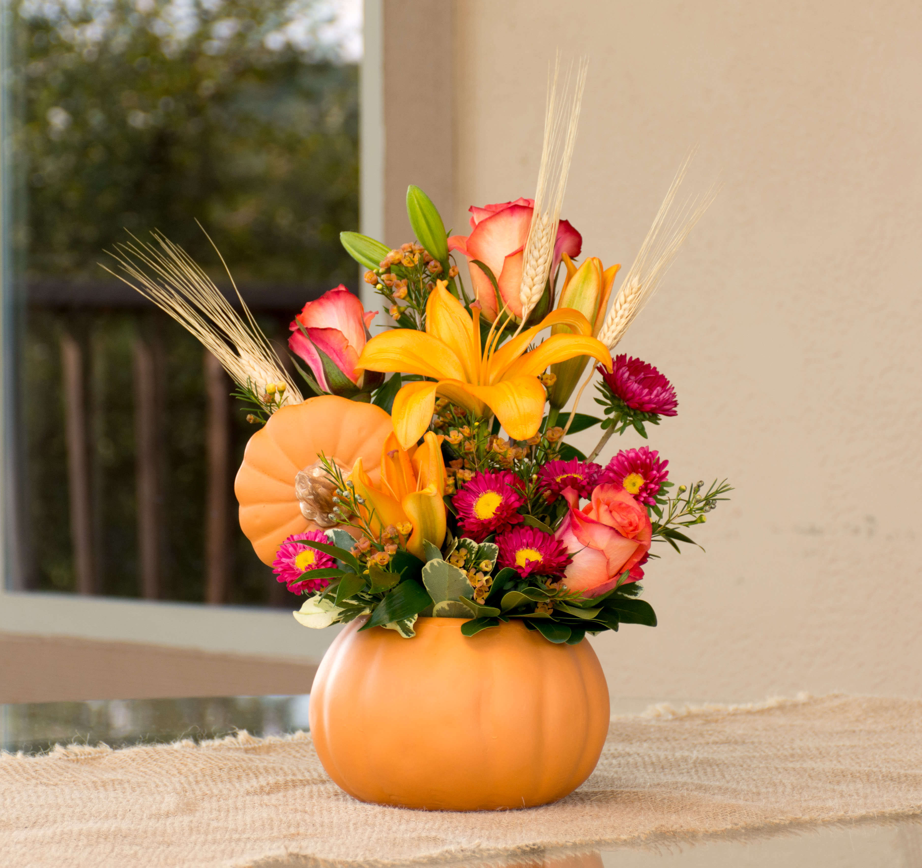 October Classic October Classic -  Ceramic pumpkin featuring lilies, roses, and asters.