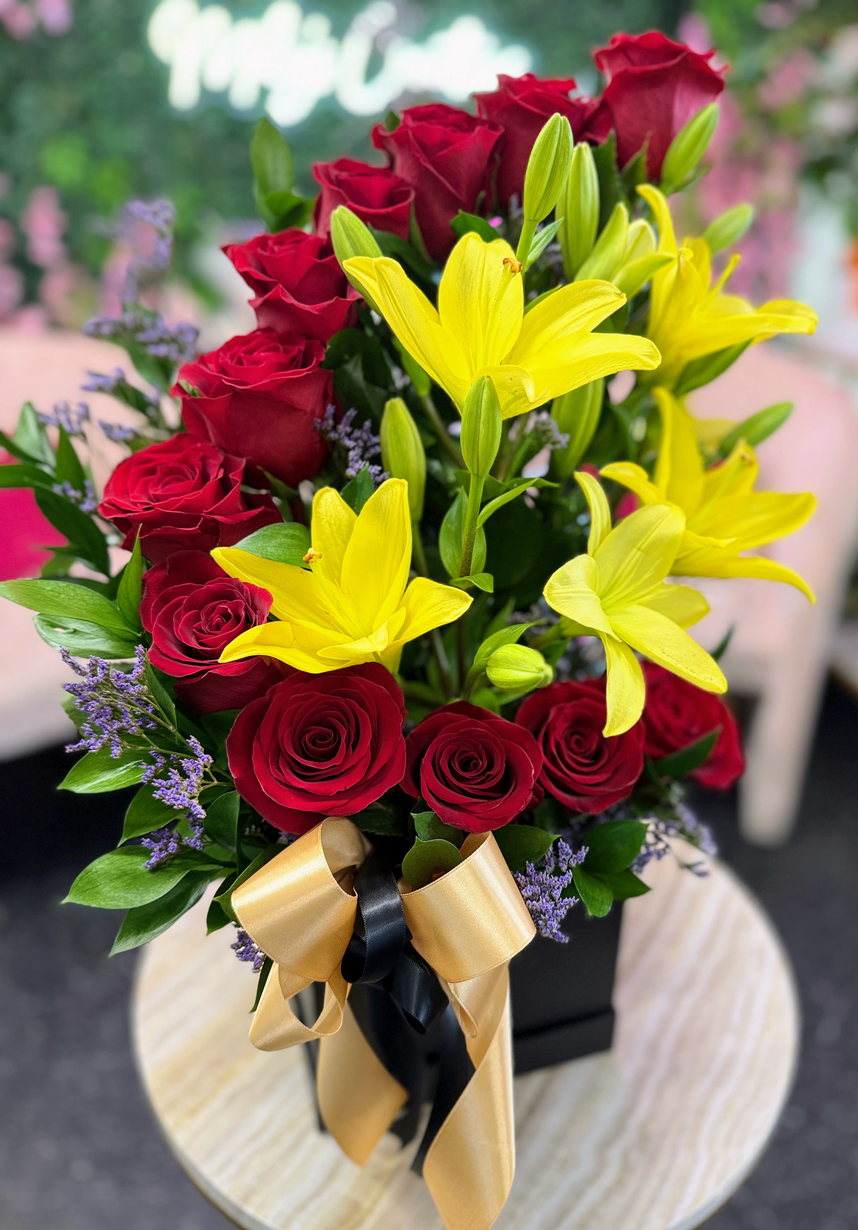 Rose &amp; Lily By Zayda - A radiant house arrangement combining the passion of classic red roses with the cheerful brightness of golden-yellow lilies. This design symbolizes love, warmth, and joy, making it a perfect gift for celebrations, housewarmings, or simply to brighten someone’s home with timeless elegance.
