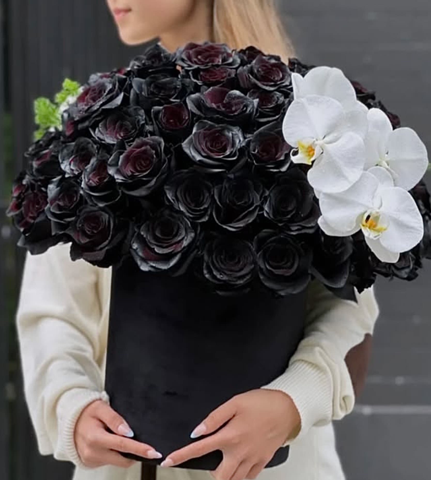 “Dark Majesty” -  Dark Majesty – A Bold Statement of Elegance &amp; Mystery   Make an unforgettable impression with Dark Majesty—a breathtaking floral masterpiece that embodies sophistication, power, and allure. Featuring luxurious black roses, symbolizing mystery and strength, beautifully contrasted with delicate white orchids for a touch of purity and grace, this arrangement is designed for those who appreciate bold elegance and unique beauty.   Perfect for:  Luxury gifts – A rare and striking expression of admiration.  Exclusive events – Add a touch of mystery to any occasion.  Sophisticated décor – Elevate your space with timeless beauty.  Dare to be different. Order Dark Majesty today and embrace the art of bold elegance. 