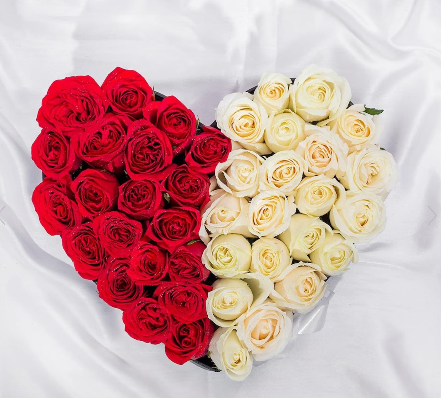 Love Roses  - ️ A Love That Blooms in Every Color ️  Surprise your special someone with this breathtaking heart-shaped arrangement of roses! Half fiery red, symbolizing deep passion, and half elegant ivory, representing pure love—this stunning bouquet is the perfect way to express your emotions.   Handcrafted with fresh, premium roses  Ideal for anniversaries, Valentine’s Day, or any romantic occasion  Delivered with care to make your loved one’s day unforgettable  Say it with roses. Say it with love. Order now! 