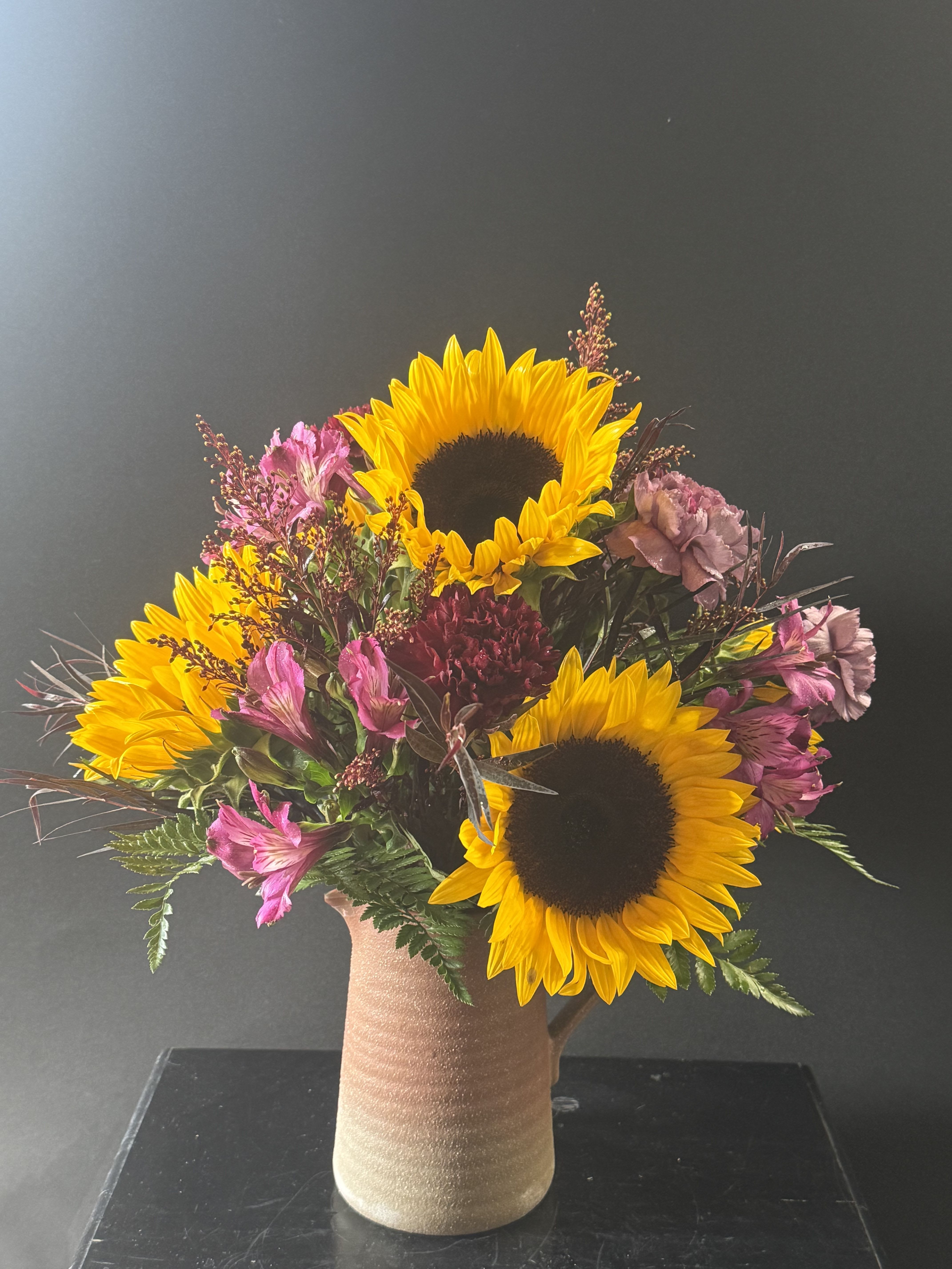 Autumn Amethyst Autumn Amethyst - A rich mix of golden yellows and deep purples and reds, autumn amethyst brings the beauty of fall into full bloom. This arrangement adds a touch of elegance and warmth to any room or occasion.