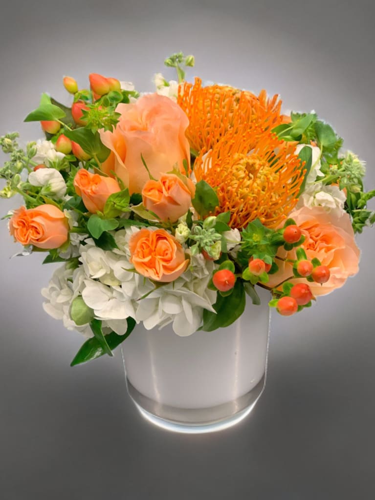 Shades of orange and peach - Orange and peach flowers accented with lime green: roses, hydrangeas, and mini hydrangeas designed 