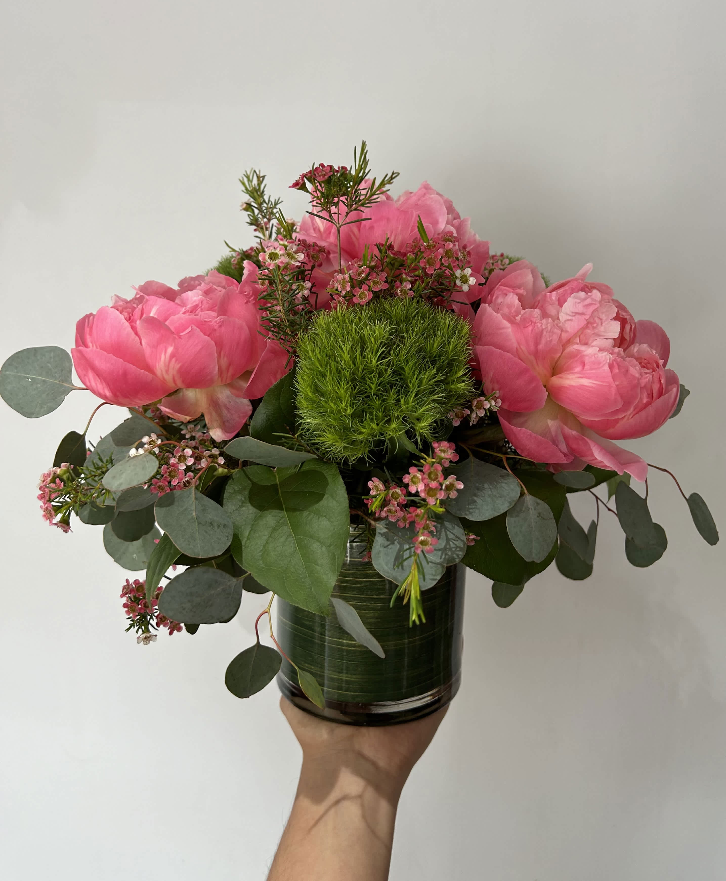 Summer Peony  - Seasonal peonies arranged with fillers and greens in a vase. 