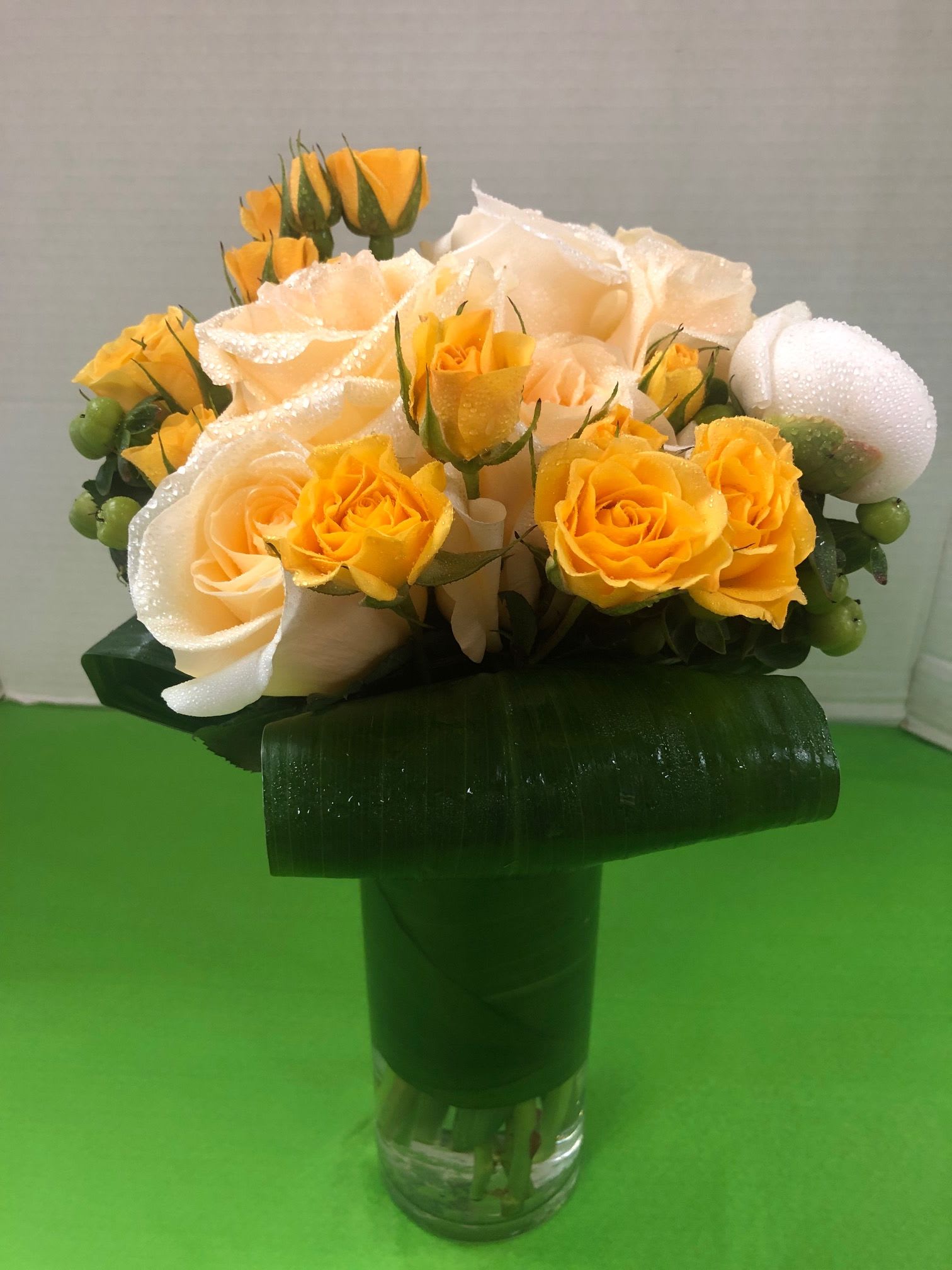  Assorted Rose Arrangement - Fancy  Greens  - Assorted Roses &amp;  Assorted Fancy Holiday Greens. The final design of roses  will depend upon availability of roses in the store. Call The store for availability of your favorite colors 908-234-2900 