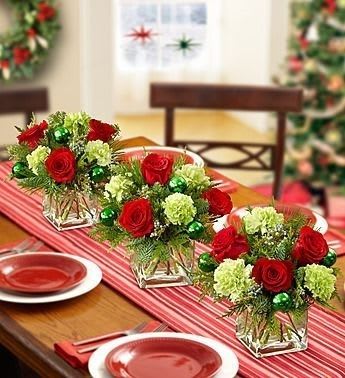 Holiday Floral Cubes (Available in Sets of 3, 5 or 7) Holiday Floral Cubes (Available in Sets of 3, 5 or 7) - Cubes filled with green carnations, red roses and other festive holiday accessories can be purchased as a set of three, set of five or set of seven. These cubes or cylinders (5x5 diameter) would be perfect for the center of any table or to be spread out throughout the entire room. These are perfect for your private home party or your corporate holiday gathering. Note: Standard Size - 3 Cubes/Cylinders, Deluxe Size - 4 Cubes/Cylinders, Premium Size - 5 Cubes/Cylinders