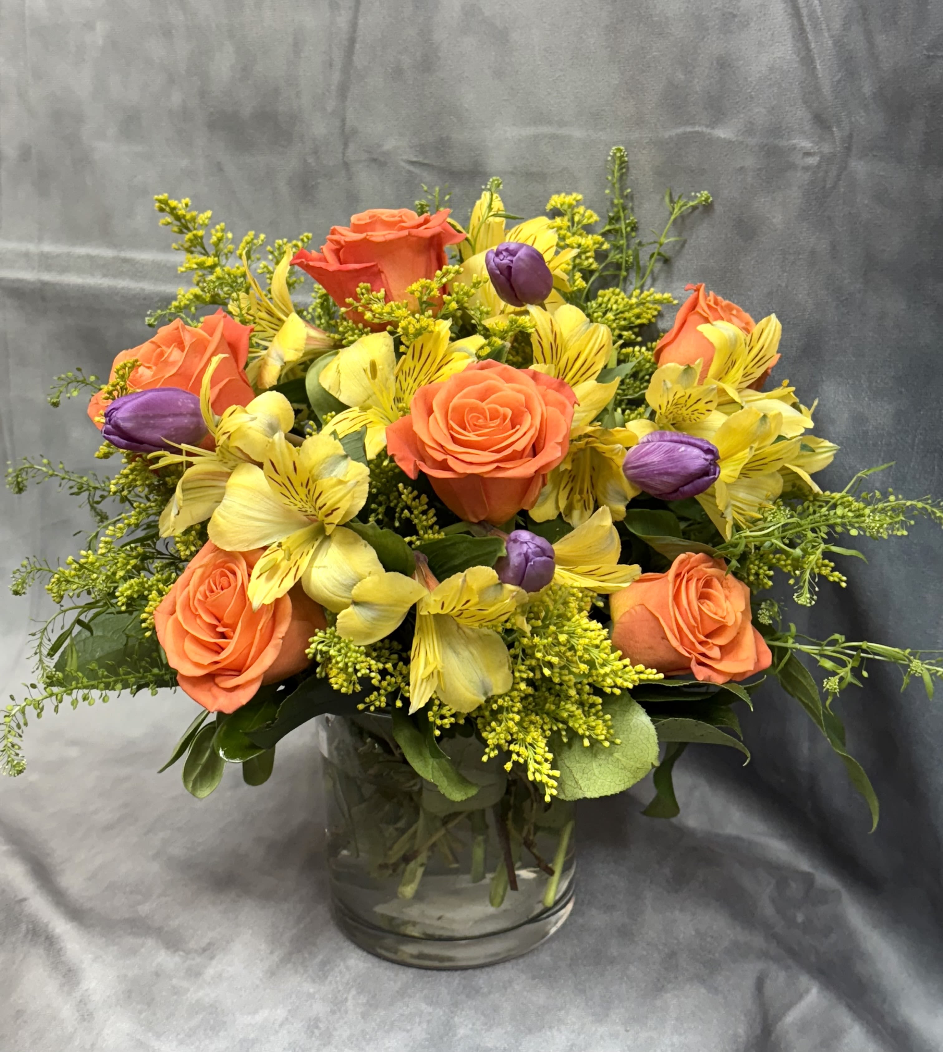 Roses Tulips Lovers  - A charming vase arrangement designed for rose and tulip lovers, featuring a romantic blend of fresh roses, vibrant tulips, delicate alstroemeria, and lush seasonal fillers. A perfect harmony of color and texture to brighten any space or occasion.