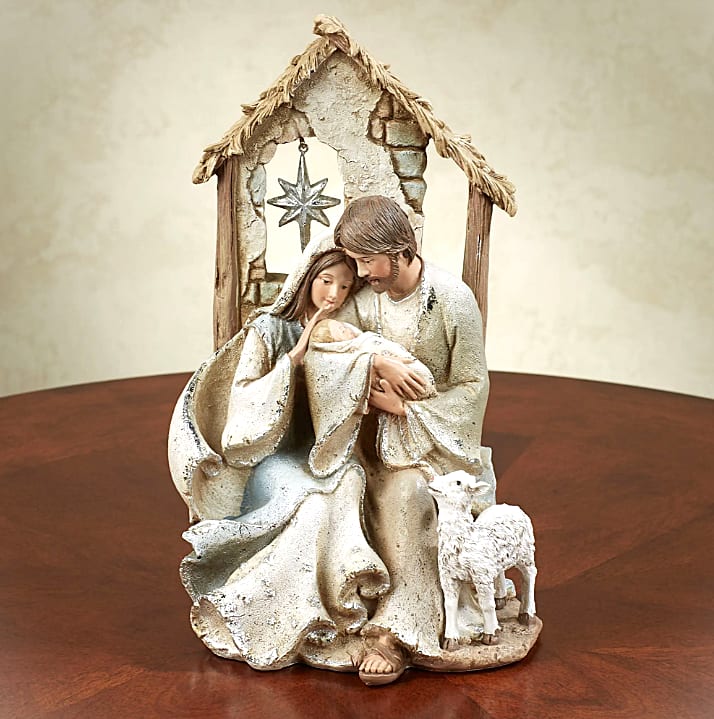 Christmas- Holy Family Nativity - Measures 6&quot;Wx5&quot;Dx9.5&quot;H. On the back of the stable it reads &quot;For unto us is born this night a Child who brings Peace and Love to all mankind&quot; in text and script. 