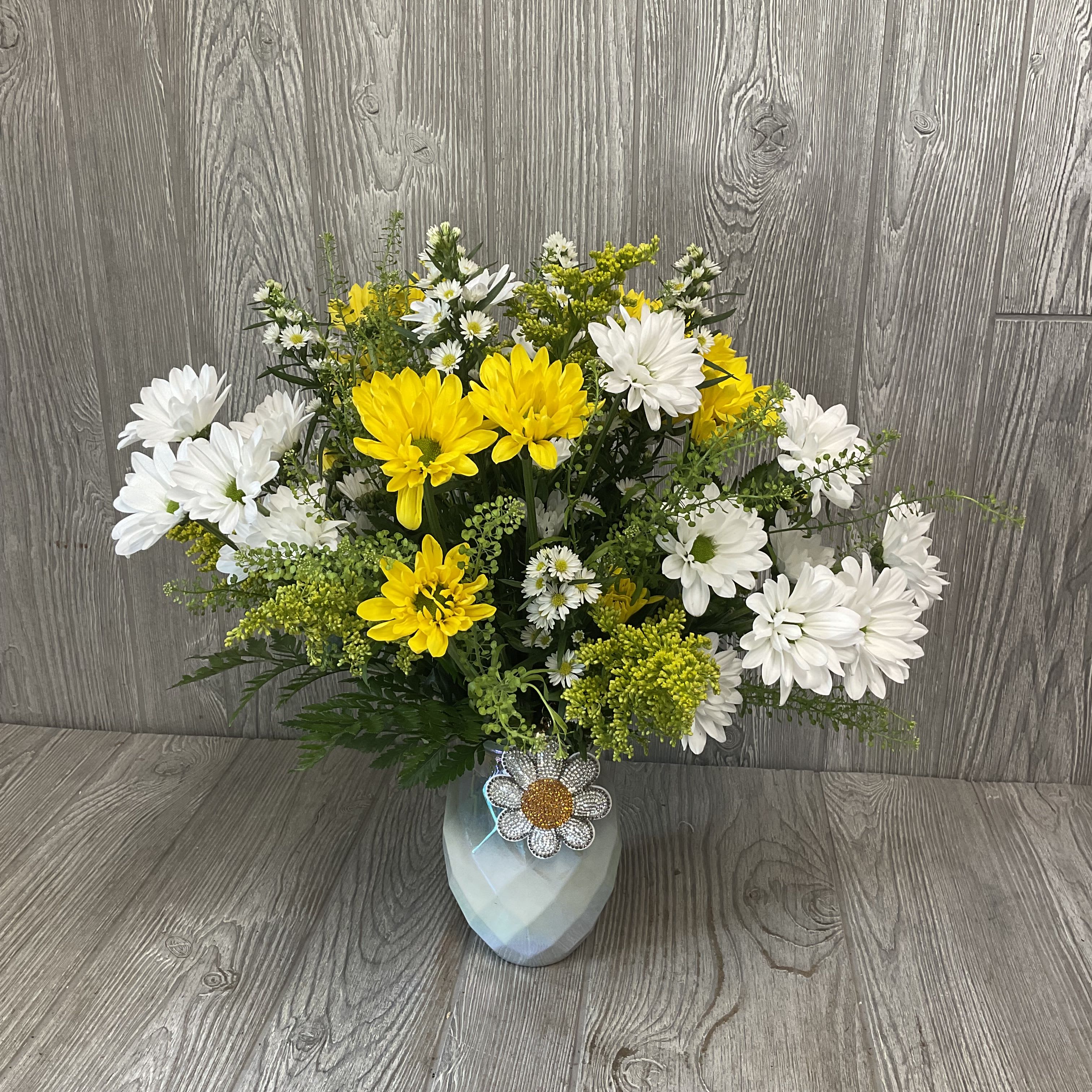 Oopsy Daisy! Oopsy Daisy! - An assortment of beautiful fresh daisies, arranged in a vase with a rhinestone daisy keychain included. Colors may vary.