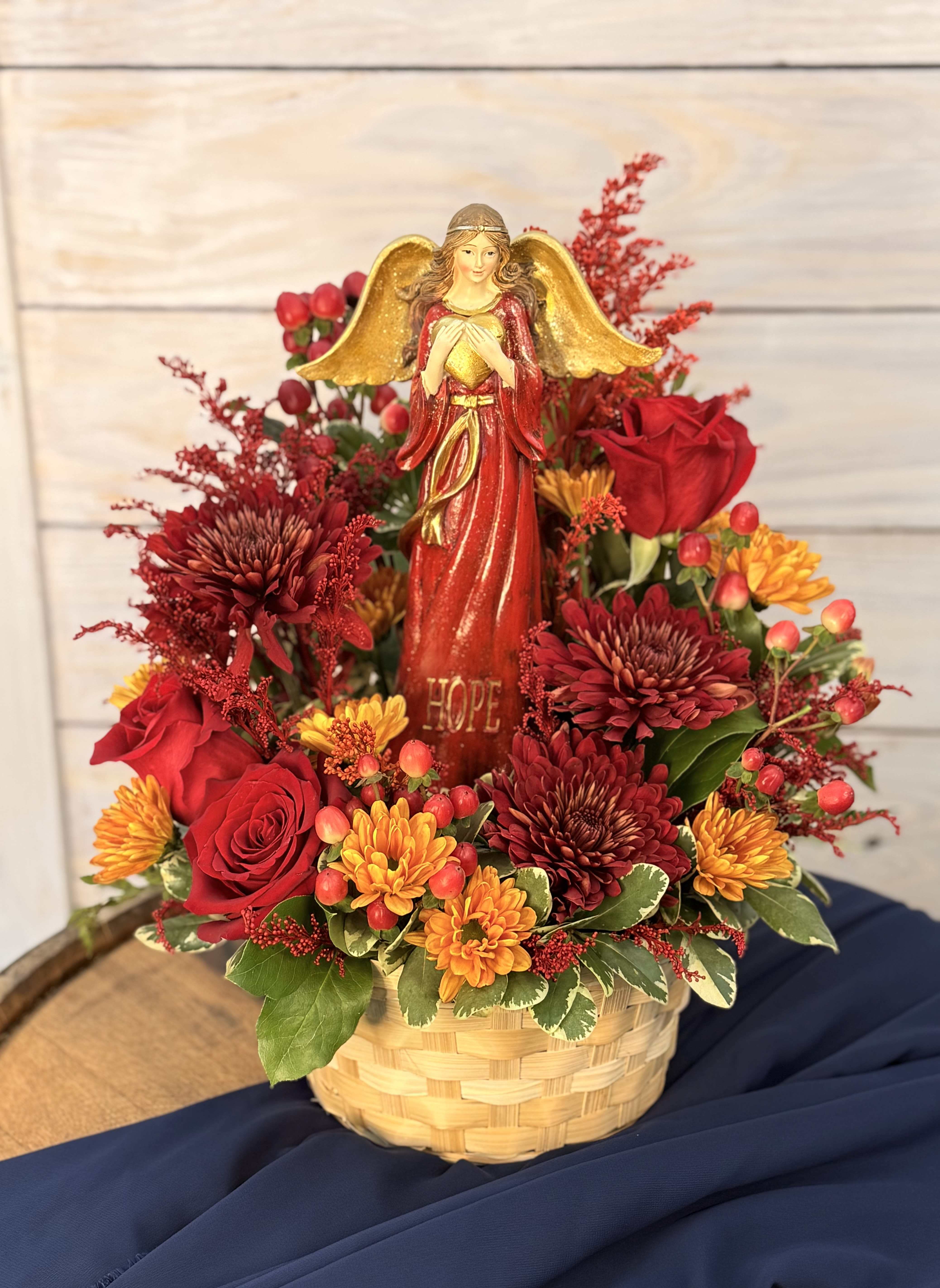 Autumn's Guardian - Red roses with touches of burgundy and golden blooms makes this arrangement feel like hope's loving embrace. 