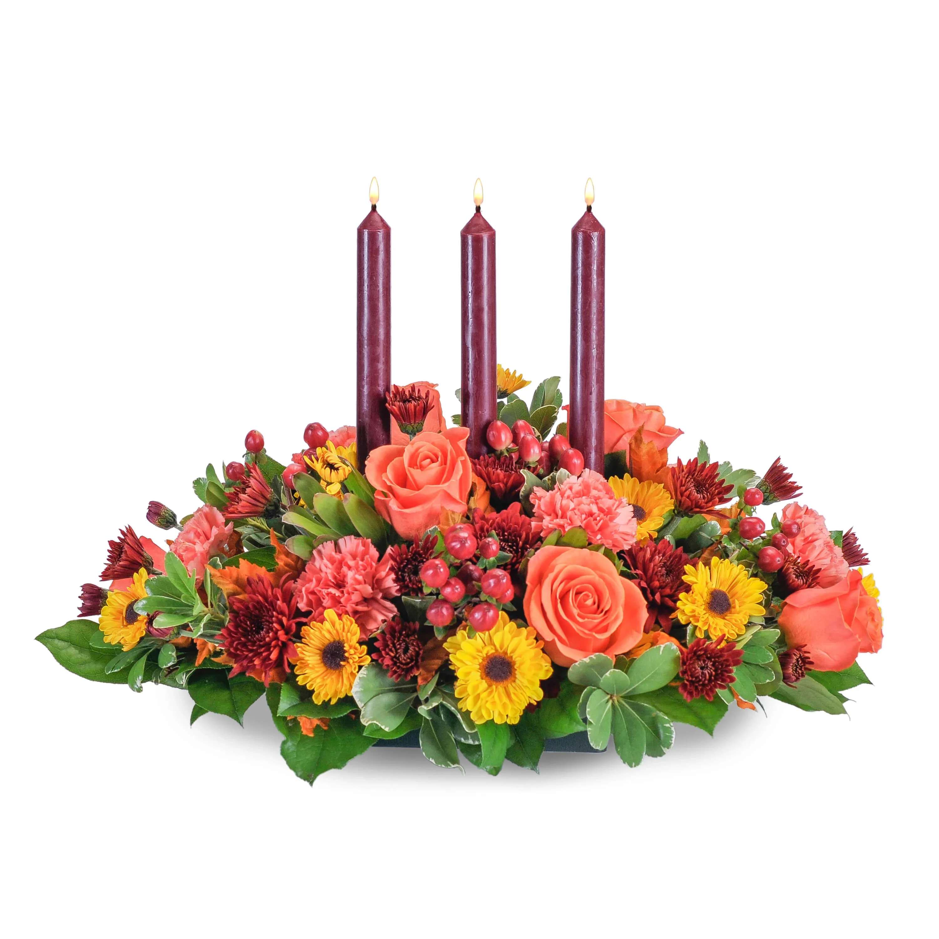 Pumpkin Glow Pumpkin Glow - Fall flowers, with the warm glow of a candle, will prepare your table for your special celebration. You just need the pumpkin pie! Orange roses and carnations, spray mums and fall leaves and berries surround taper candles.