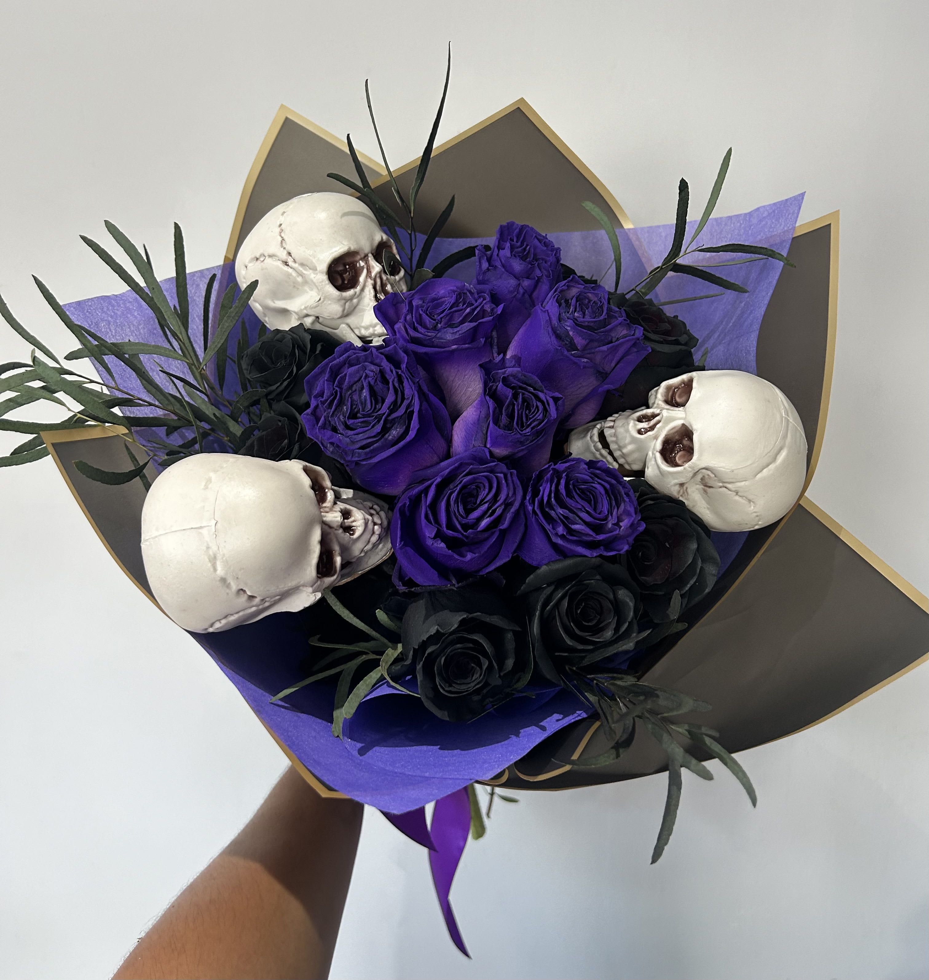 Skull Love Skull Love - Black and purple roses arranged with skulls into a hand-tied bouquet.
