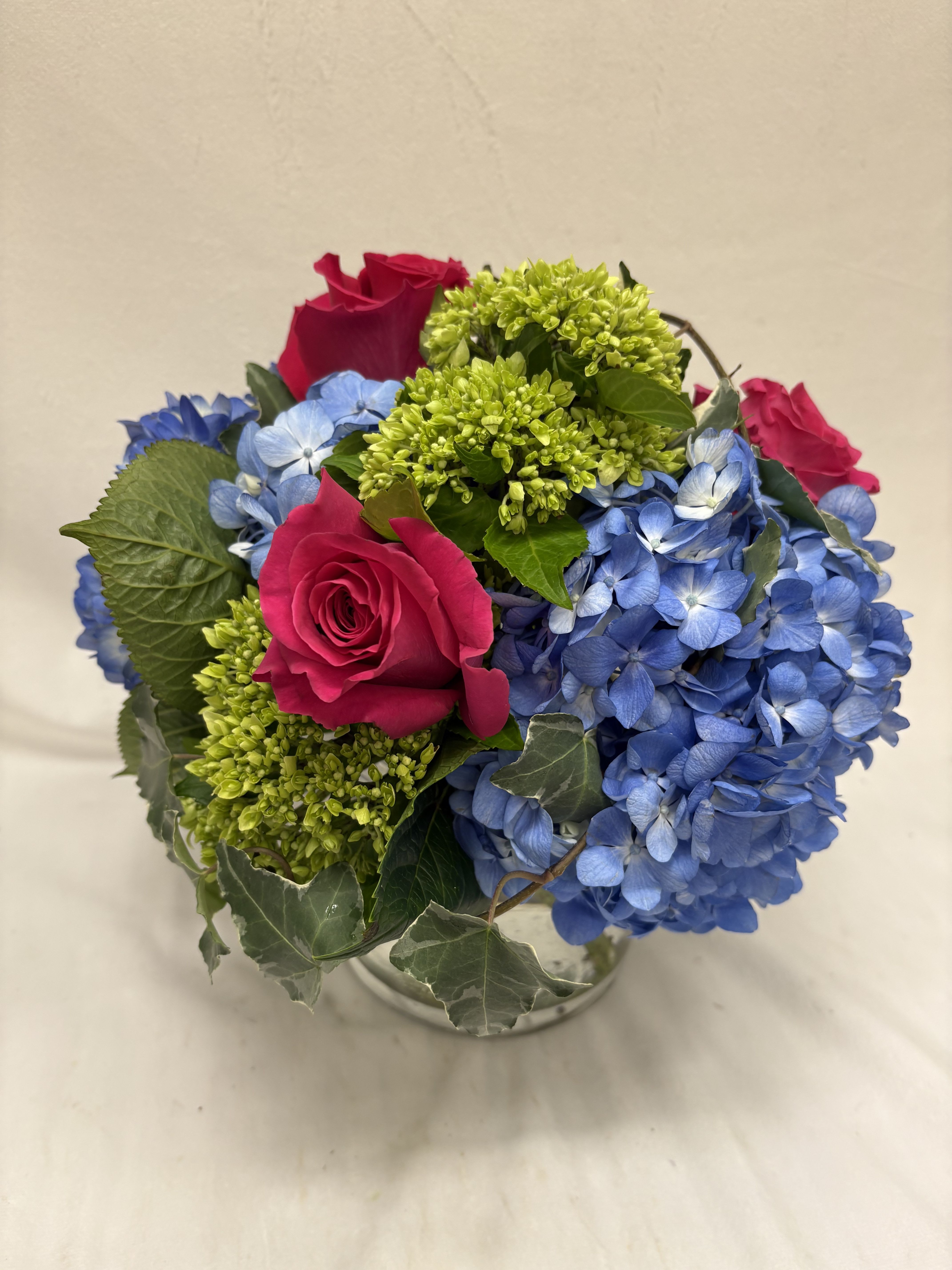 Vivid - Shocking green and blue hydrangea paired with our favorite hot pink rose, another Bon Fleur classic