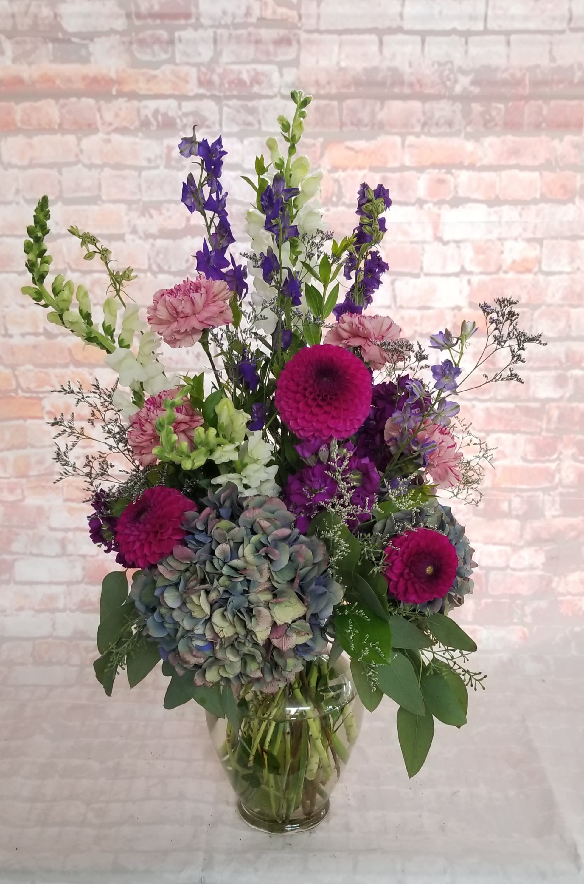 Season's Essence Season's Essence - Select this seasonal combination of blooms.