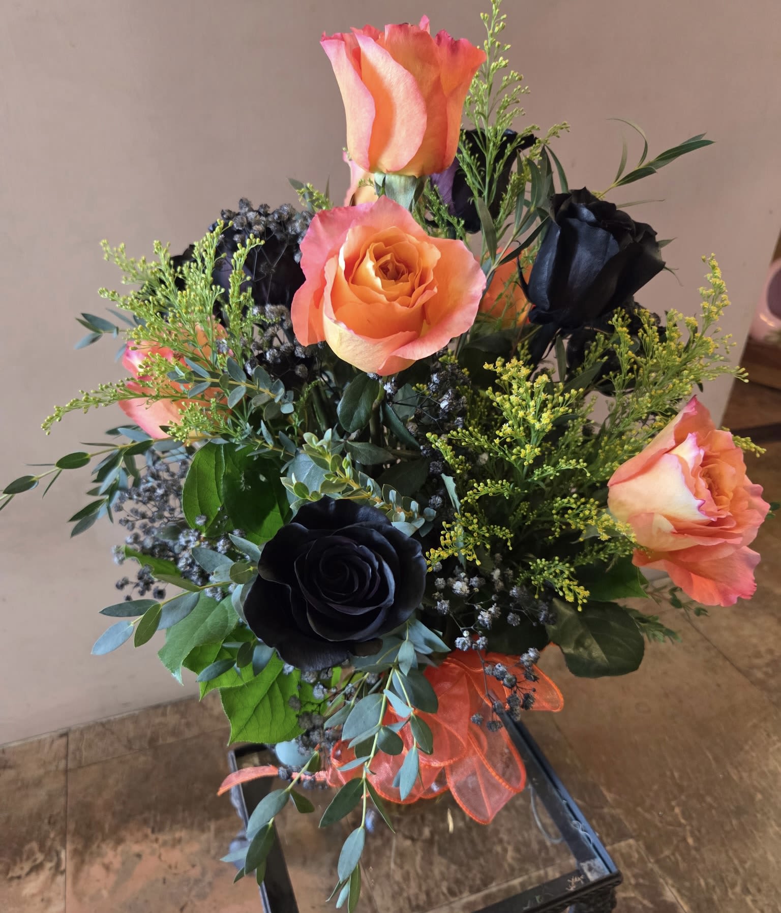 Boo-quet of Frights Boo-quet of Frights - A hauntingly beautiful take on a classic dozen roses. This arrangement brings just the right touch of fright and floral delight!