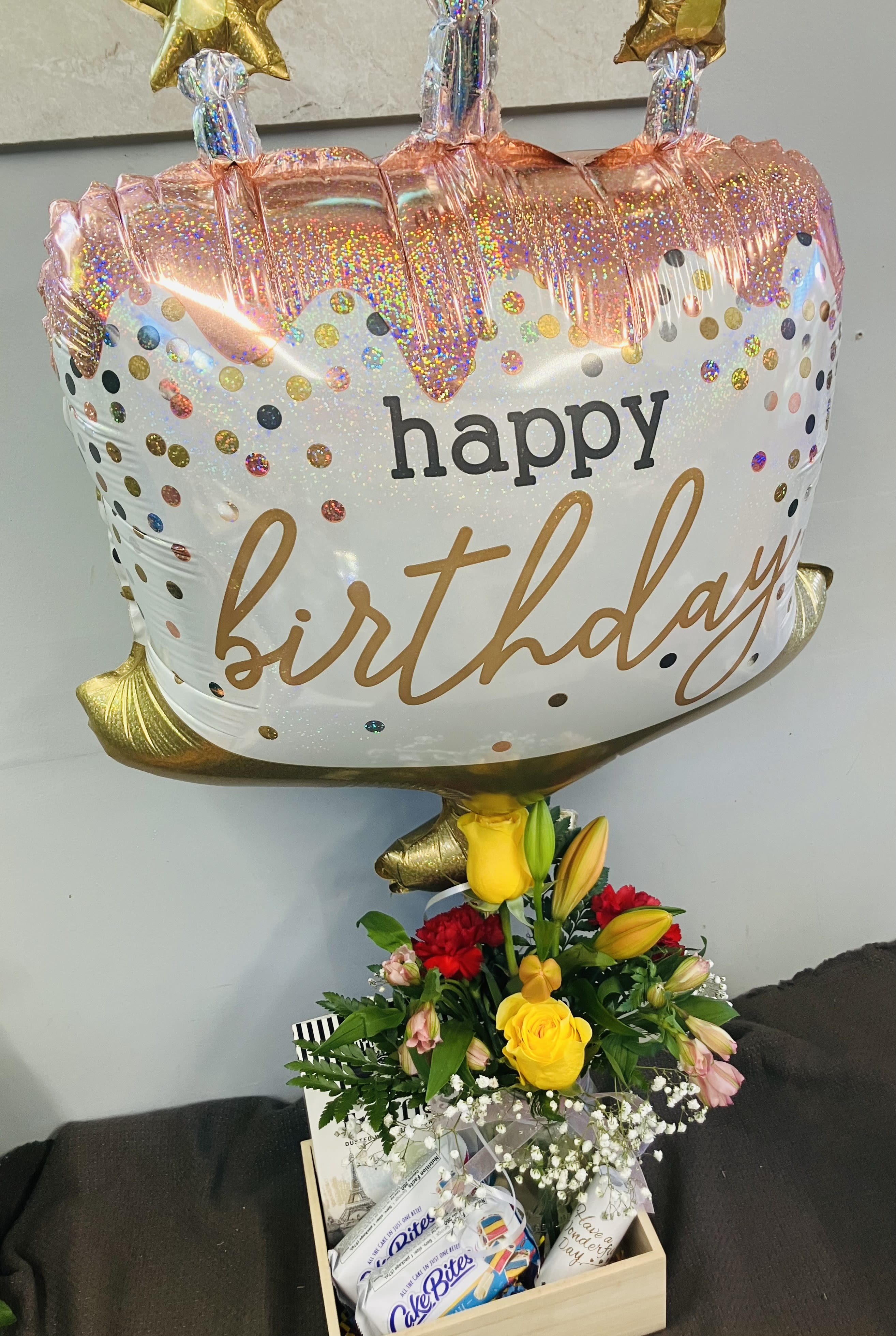 Birthday Party in a Box Birthday Party in a Box - Specifically designed for a mini birthday party, sweet treats, flowers and a happy birthday mylar balloon in a box! Items included in the box are a cakeBites, confetti, chocolates, a colorful fresh flower arrangement in a mason jar and mylar balloon. Send a special birthday gift to let them know you are celebrating with them in spirit!