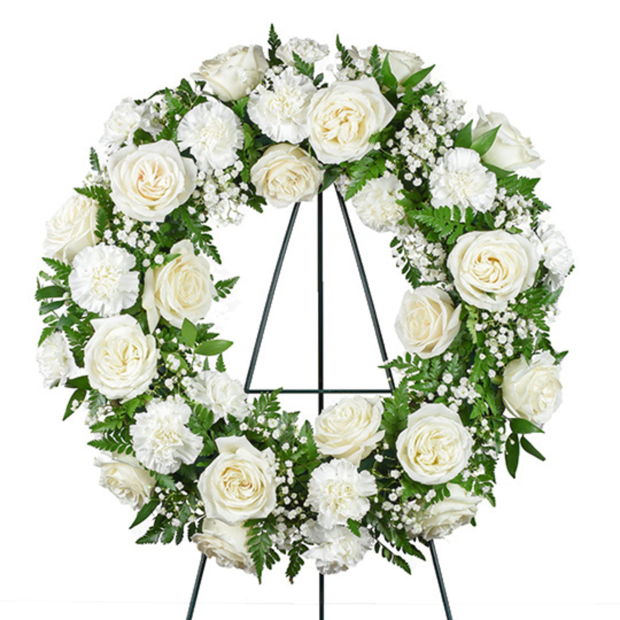 Tranquil Remembrance Standing Wreath by Birch &amp; Blossom - Soft and sincere, Tranquil Remembrance embodies the quiet beauty of reflection. White roses and carnations bloom in gentle harmony, surrounded by delicate clouds of baby’s breath; a timeless expression of purity, peace, and enduring love.  This wreath offers comfort through its simplicity, reminding us that even in moments of sorrow, there is light in remembrance and grace in every goodbye.  Tenderly arranged at Birch &amp; Blossom, Tranquil Remembrance honors memory with calm elegance and heartfelt care.