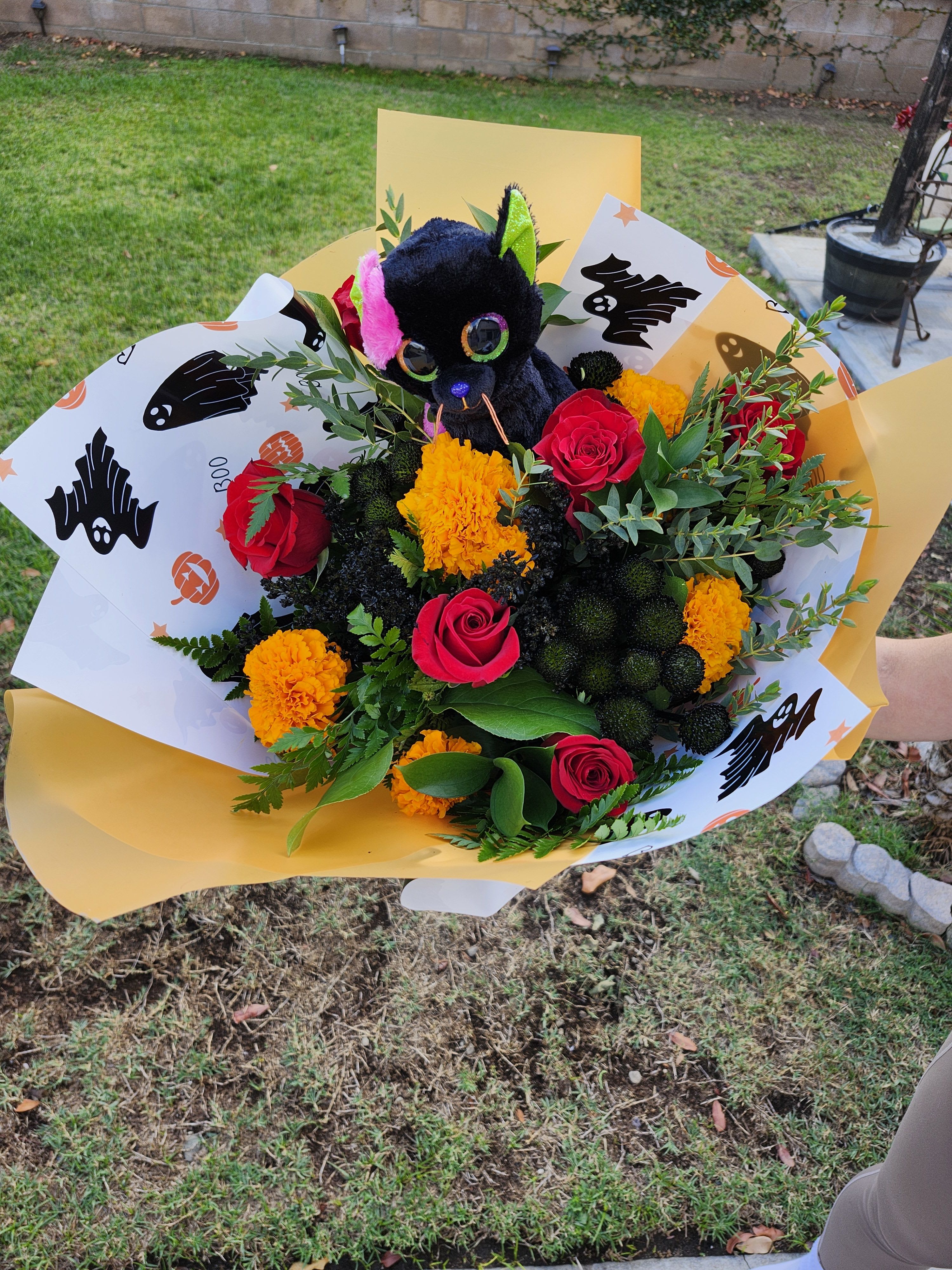 Rose Designer's Choice Halloween wrapped bouquet - Designer's Choice with roses and Marigolds Halloween theme paper wrapped bouquet 