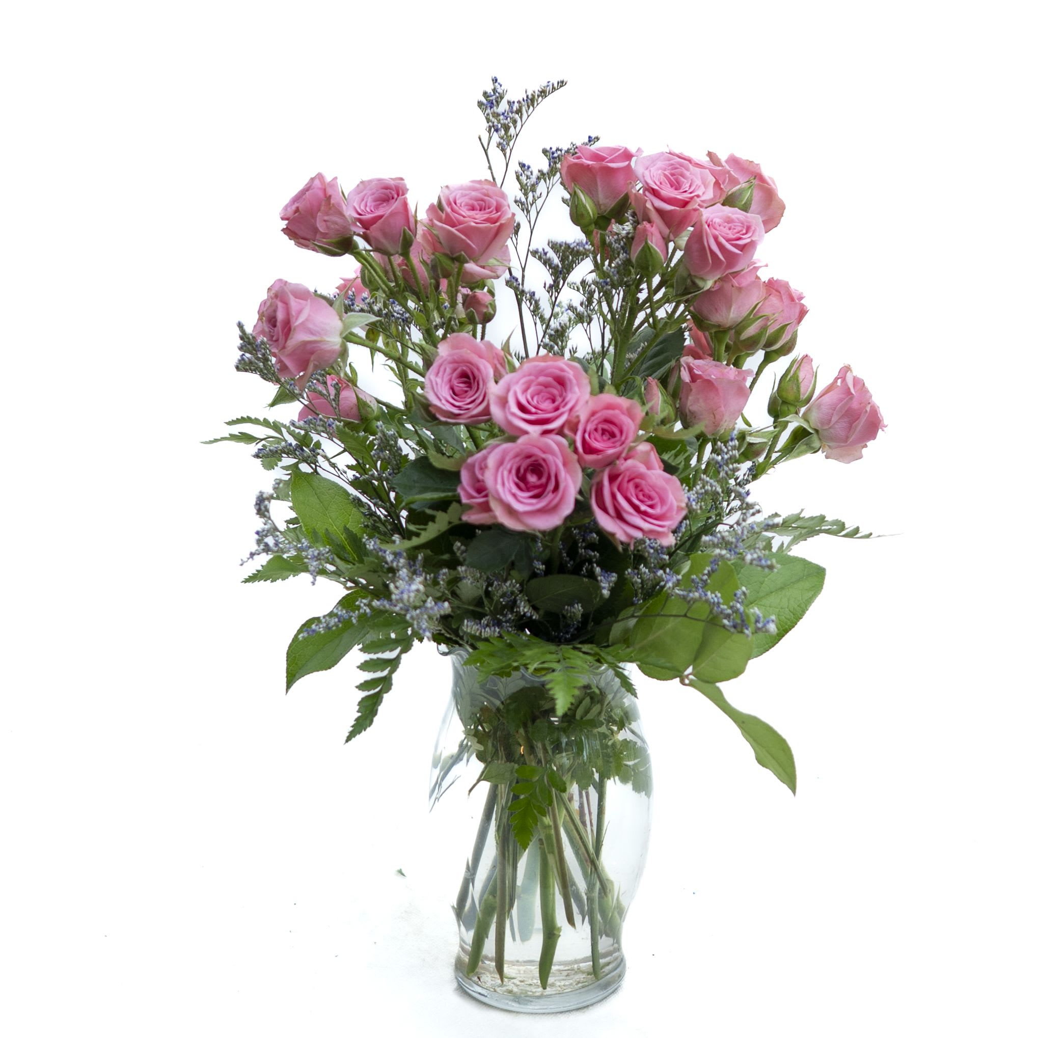 Pretty in Pink Rose Bouquet - Bursting with charm and sweetness, this bouquet showcases an array of soft pink roses accented with touches of delicate filler flowers and lush greenery. Arranged in a clear glass vase, it radiates romance and grace, making it an ideal gift for birthdays, anniversaries, or simply to brighten someone’s day with beauty and love.