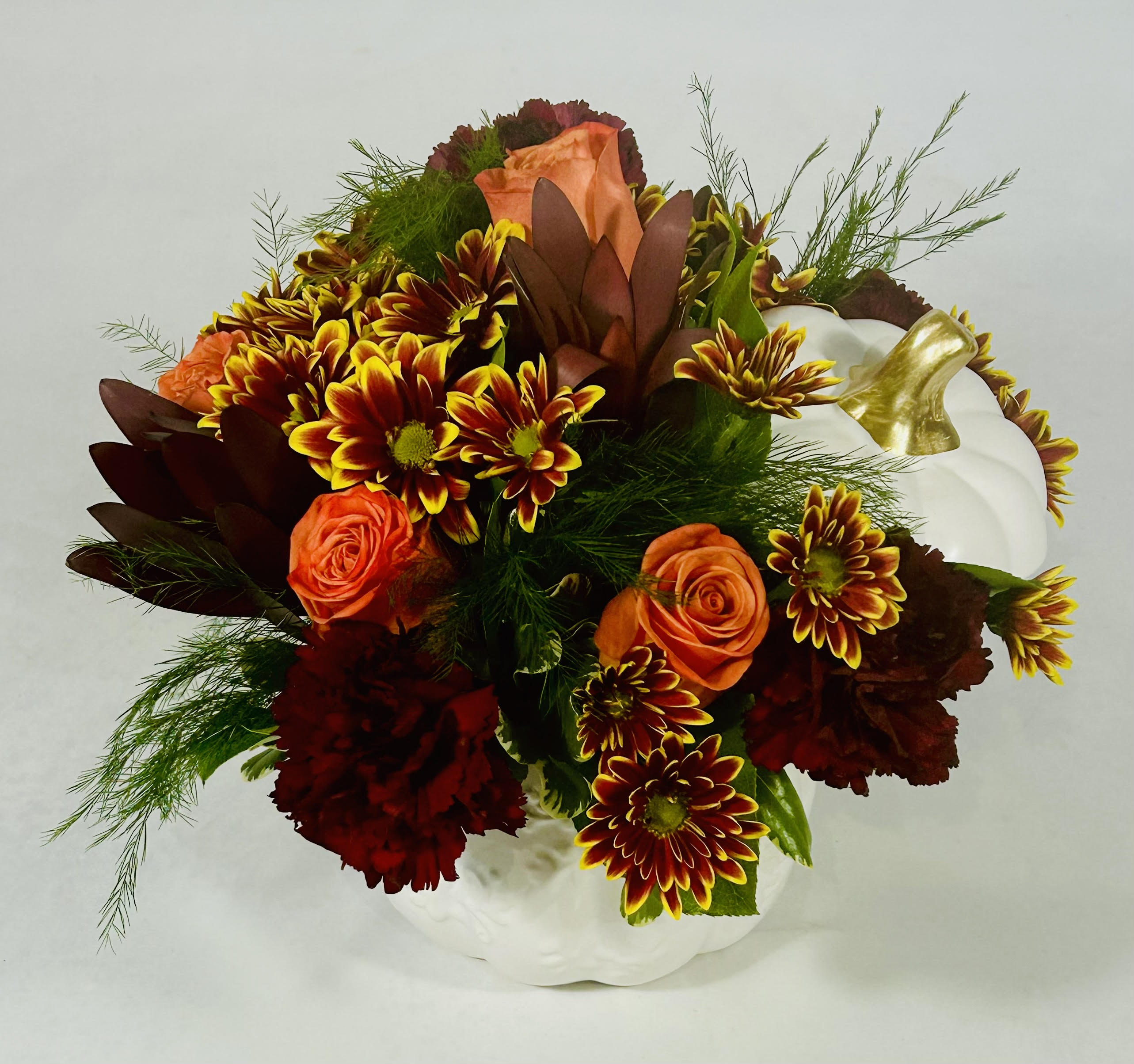 Pumpkin Delight Pumpkin Delight - White keepsake ceramic pumpkin with lid filled with beautiful fall flowers and orange roses.