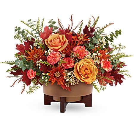 Modern Copper Centerpiece - Teleflora's Modern Copper Centerpiece brings fall to life with rich seasonal blooms, artfully arranged in a sleek metal planter with a warm copper finish and modern wooden stand. A stunning gift or décor piece for Thanksgiving and autumn celebrations