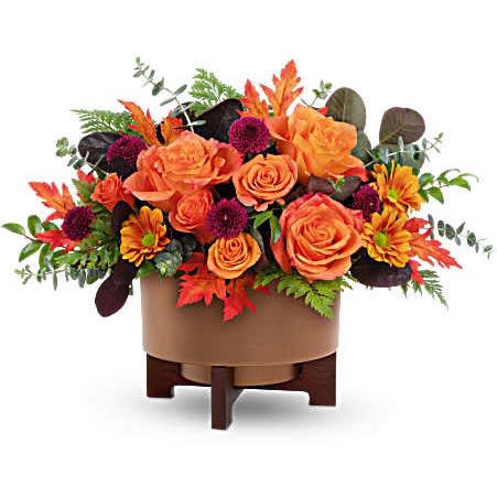 Fall For Copper Centerpiece  - Turn up the autumn glow with Teleflora's Fall For Copper Centerpiece. Bursting with vibrant orange blooms and rich fall foliage in a modern copper-finished planter, this centerpiece is a warm and stylish way to celebrate the season
