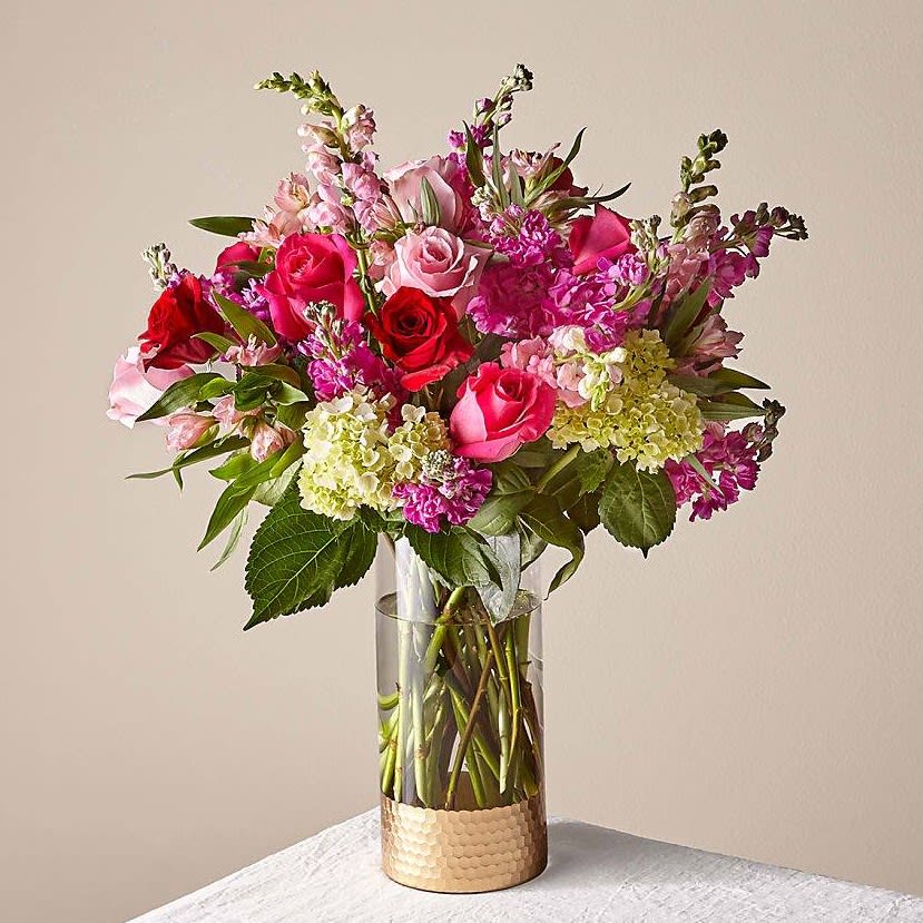 You and Me You and Me - Mulit colored Roses, Snaps, Stock, Alstro and Green Hydrang, vase and greens