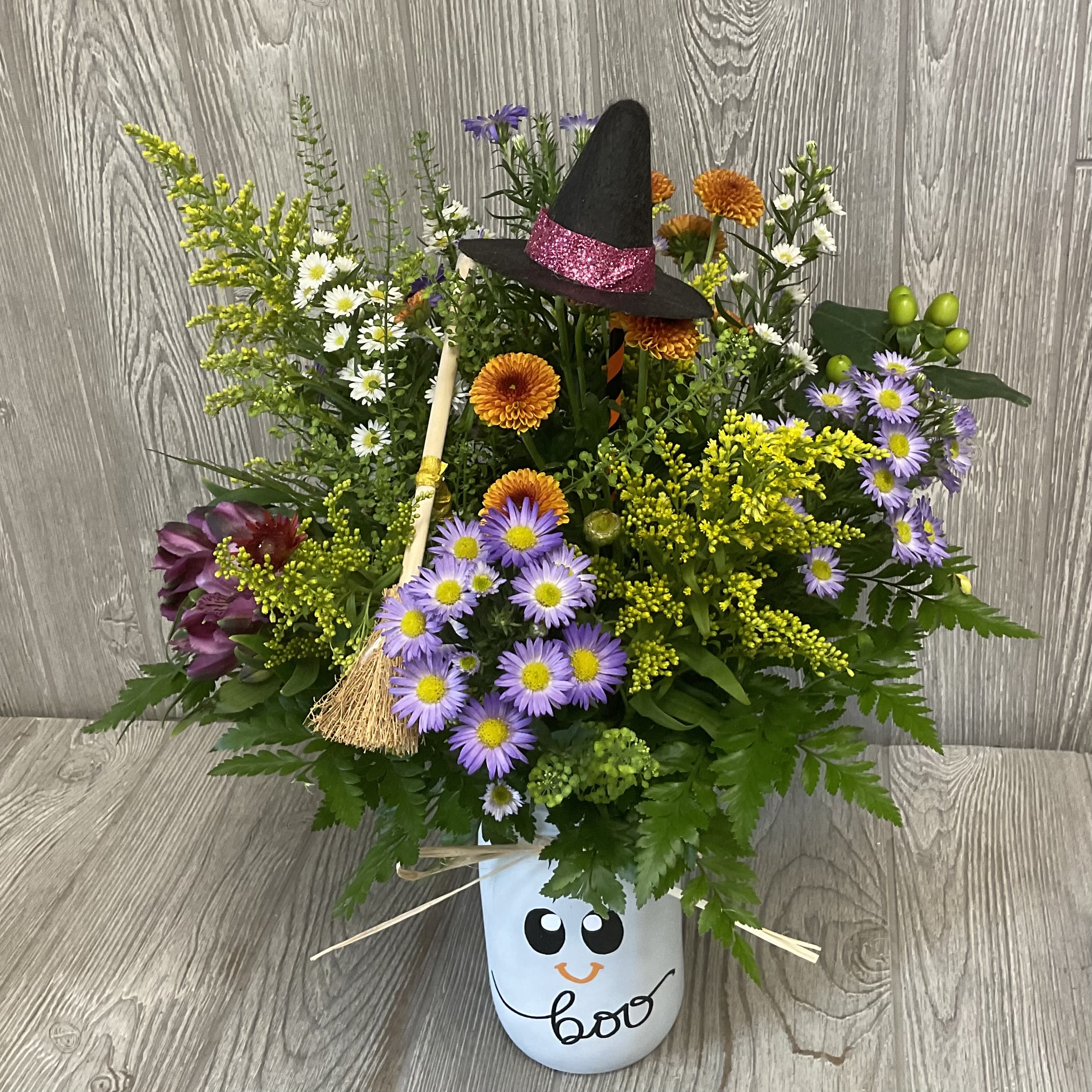 Ghost Wildflower - Arranged in a keepsake Ghost glass jar with spooky Halloween inclusions. Unique wildflower arrangement designed to look like the flowers were fresh picked along the way. Each one is uniquely made making it to where no two are alike.