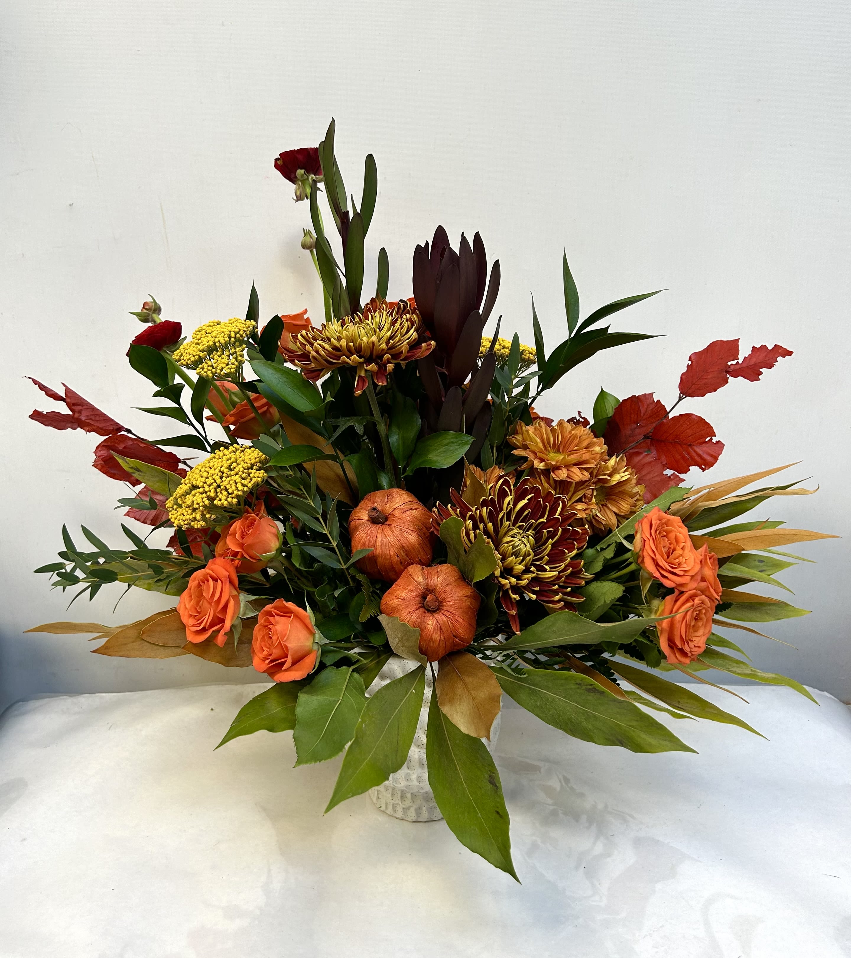 Pumpkin Fest Pumpkin Fest - Perfect for fall, this design includes pumpkins, cremones, spray roses and lots of other stems to make for a perfect gift!