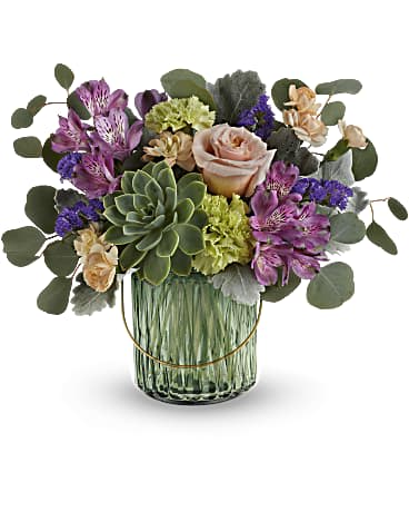 Teleflora's Storybook Rose Bouquet - Enchanting as a storybook, this sage green glass lantern with delightful rose bouquet is a whimsical gift for any occasion! This bouquet includes peach roses, purple alstroemeria, green carnations, miniature peach carnations, purple sinuata statice, dusty miller, silver dollar eucalyptus and a large potted green echeveria succulent. Delivered in a Lush Garden Lantern.