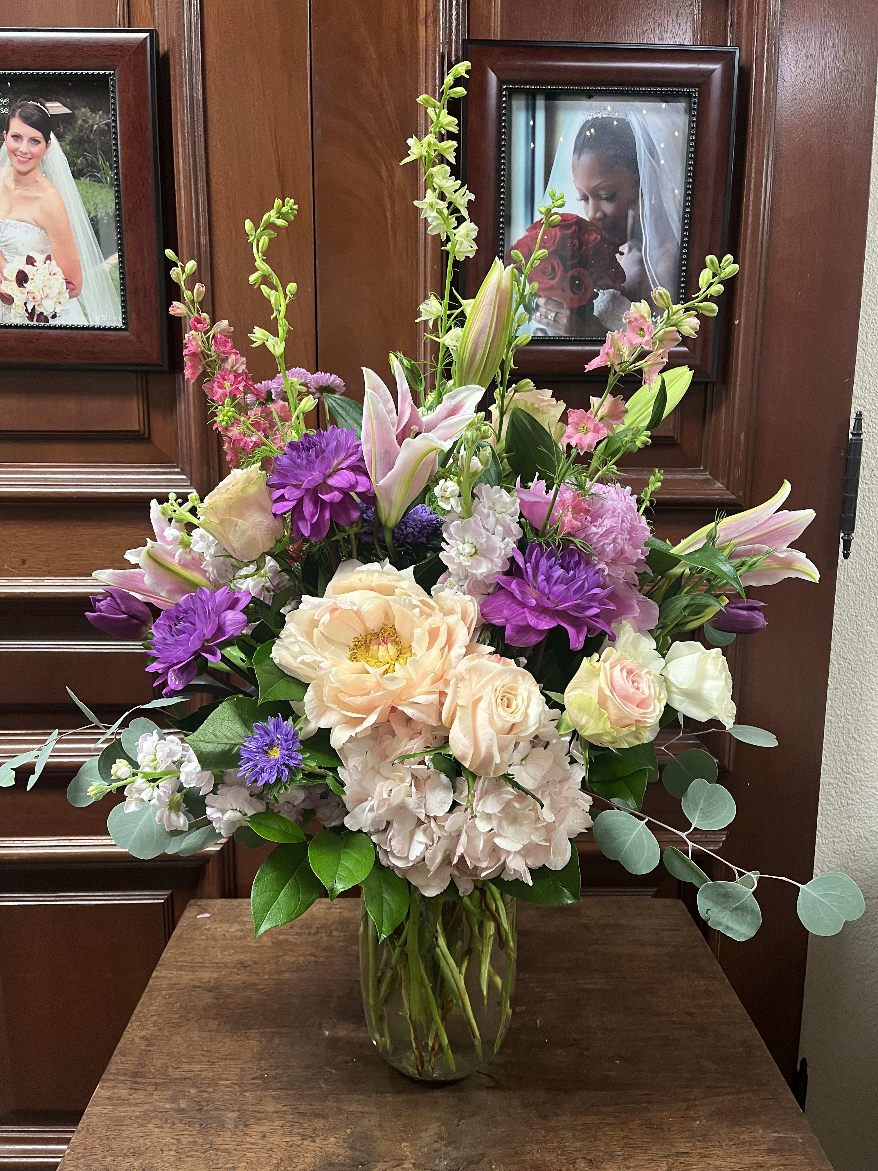 Blushing Love - Send your loved one a beautiful blushing bouquet.  Recipe: Bouquet includes pink hydrangea, pink peonies, pink roses, white stock, stargazers, lisianthus, pink snapdragons, and much more. Seasonal: Seasonal dahlias and peonies Design View: Front Facing View Photo shown: Standard 