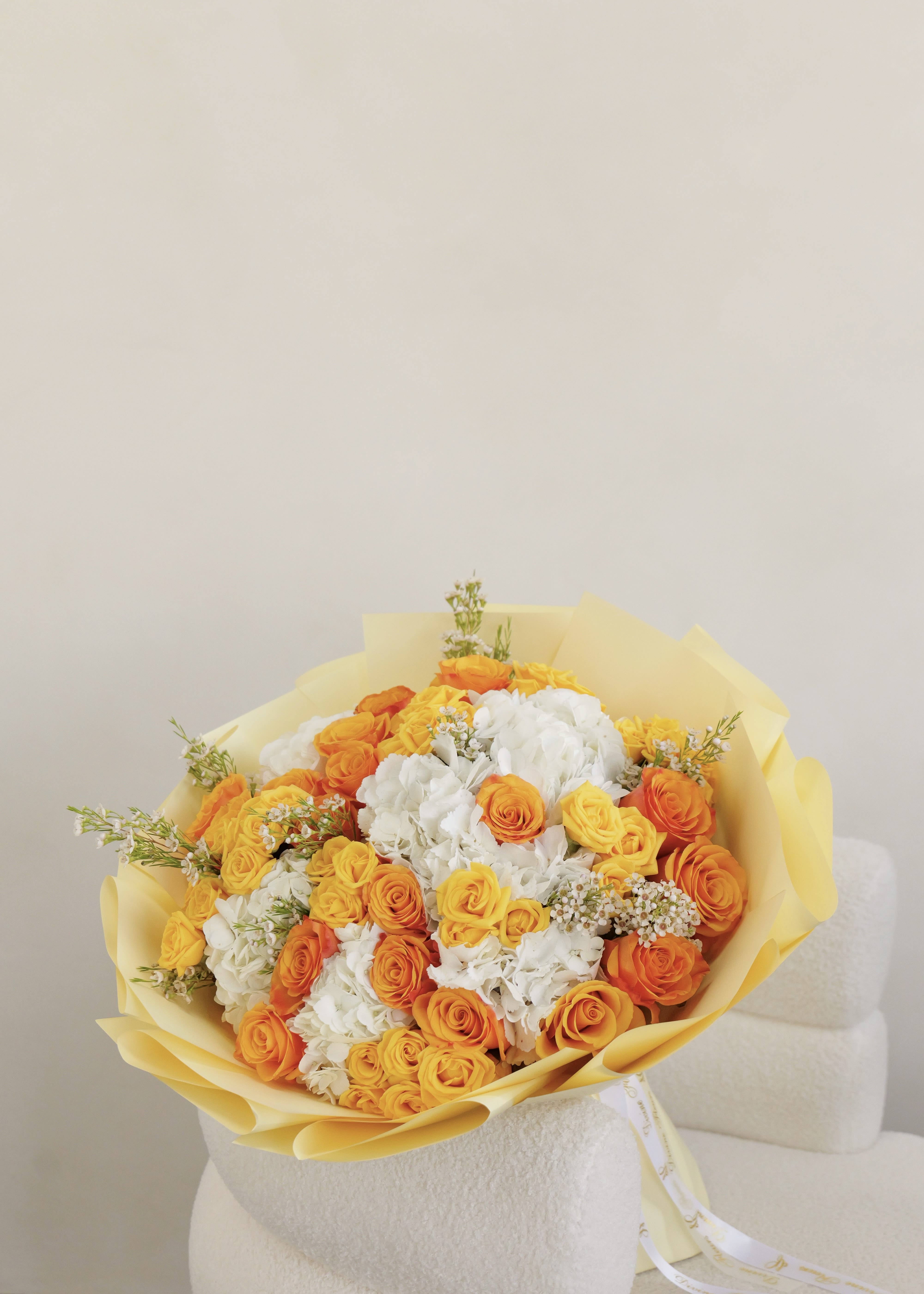 Aurelia - “Aurelia”- A touch of warmth, elegance, and timeless beauty in every petal.   The bouquet pictured is shown in deluxe size.
