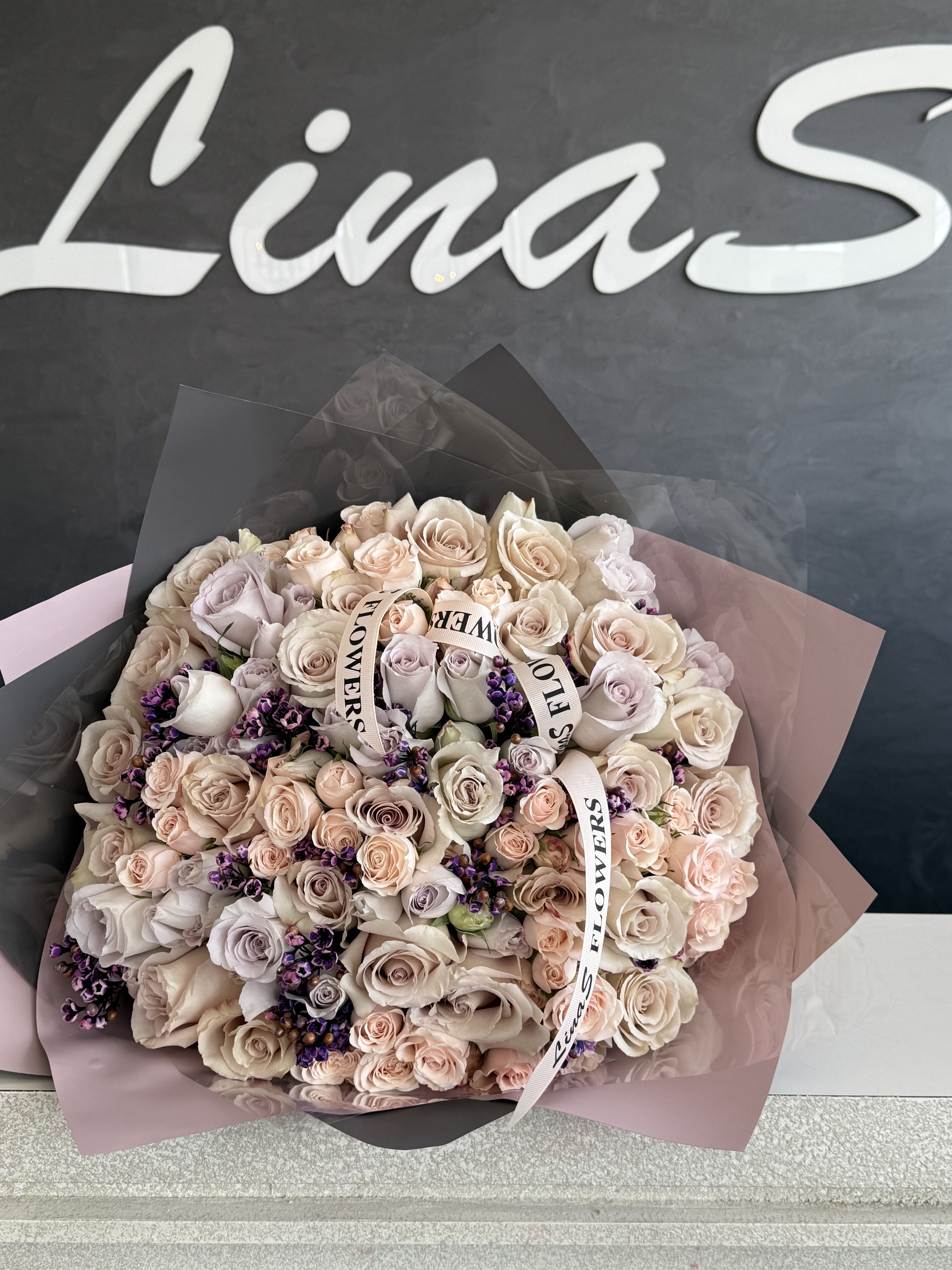 Jenya Jenya - A graceful arrangement of blush-colored flowers — gentle, refined, and effortlessly romantic.