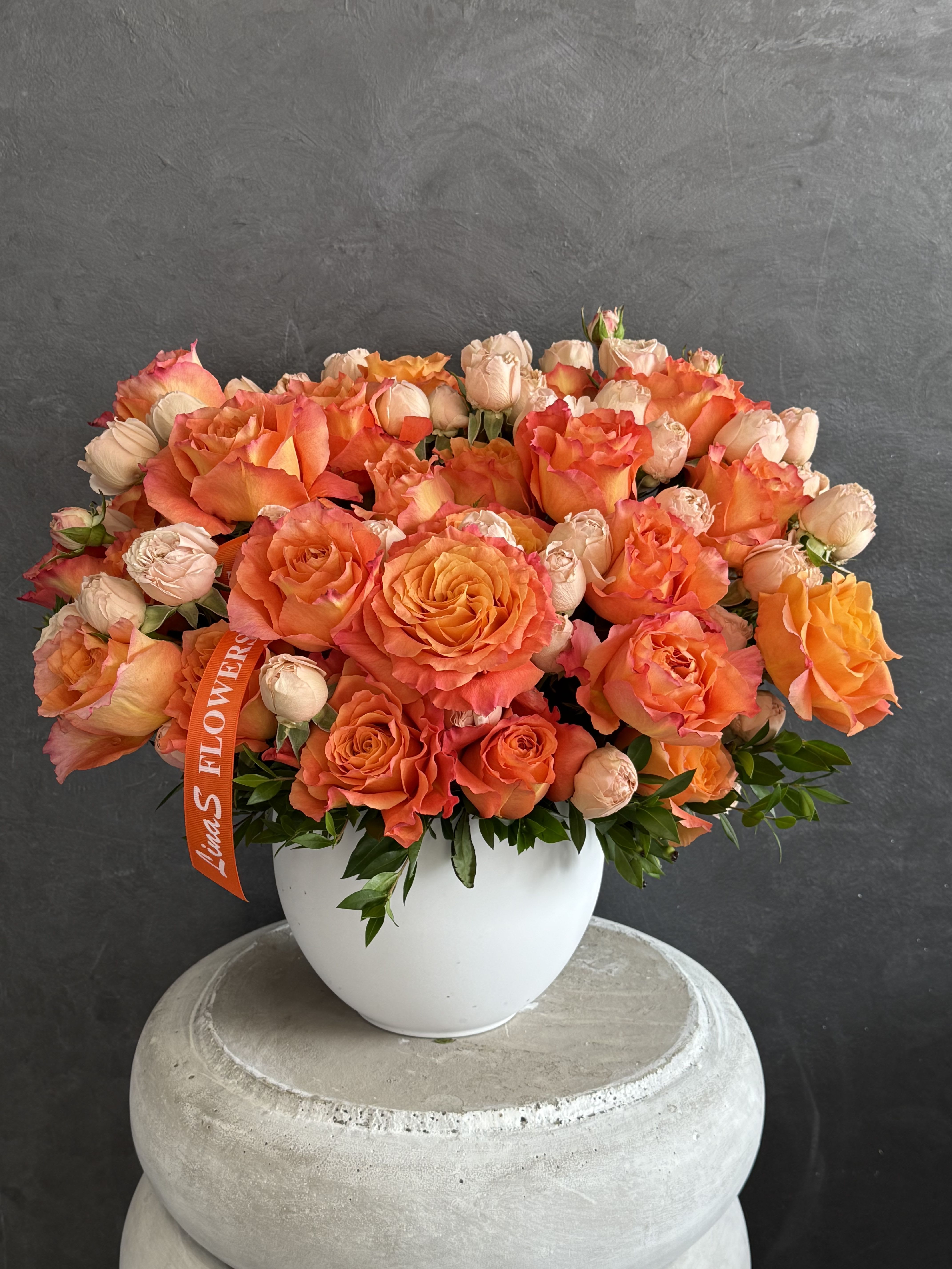 Alena Alena - A bright bouquet of orange roses — warm, cheerful, and full of energy.