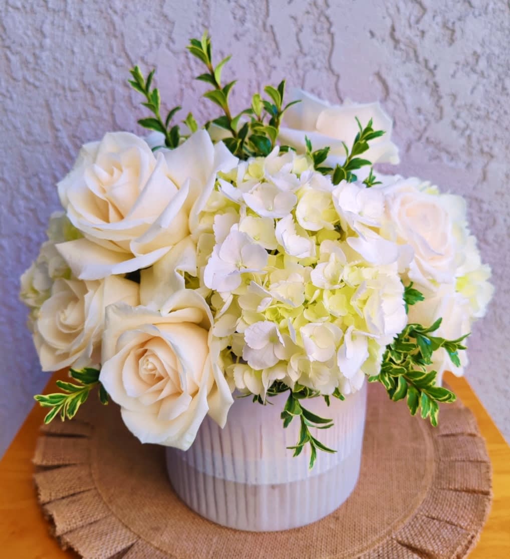 &quot; Harmony &quot; Flower Arrangement  - Beautiful white hydrangea arrangement. It's created with premium white roses, seasonal foliage and fresh hydrangeas. It includes a pretty ceramic vase in white tones ( vase design might vary depending on the availability) Size is medium  It's a round arrangement. Classic style. Share Joy Share Flowers.