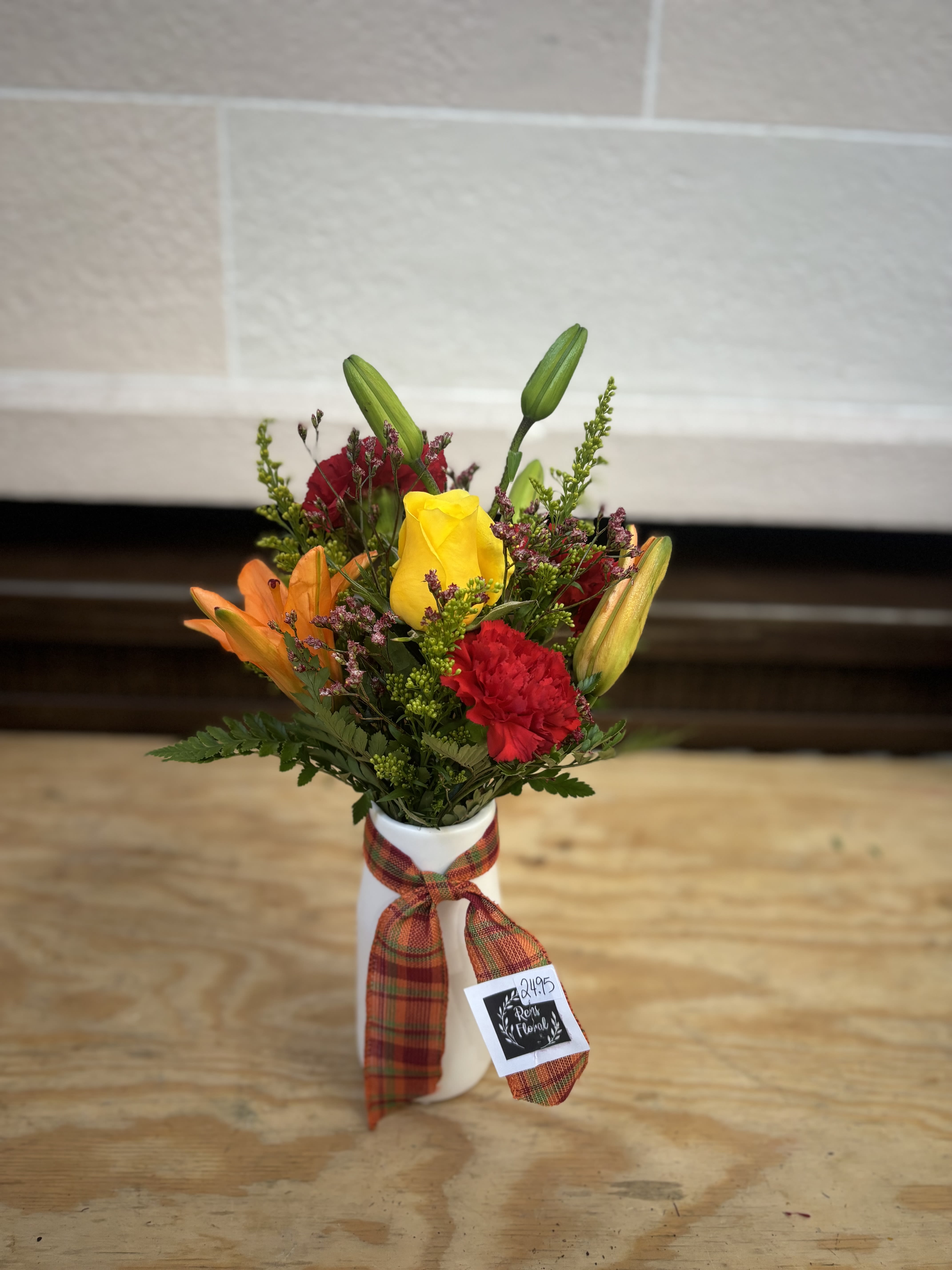 Fall Ceramic  Fall Ceramic  - A white ceramic vase filled with fresh fall flowers.