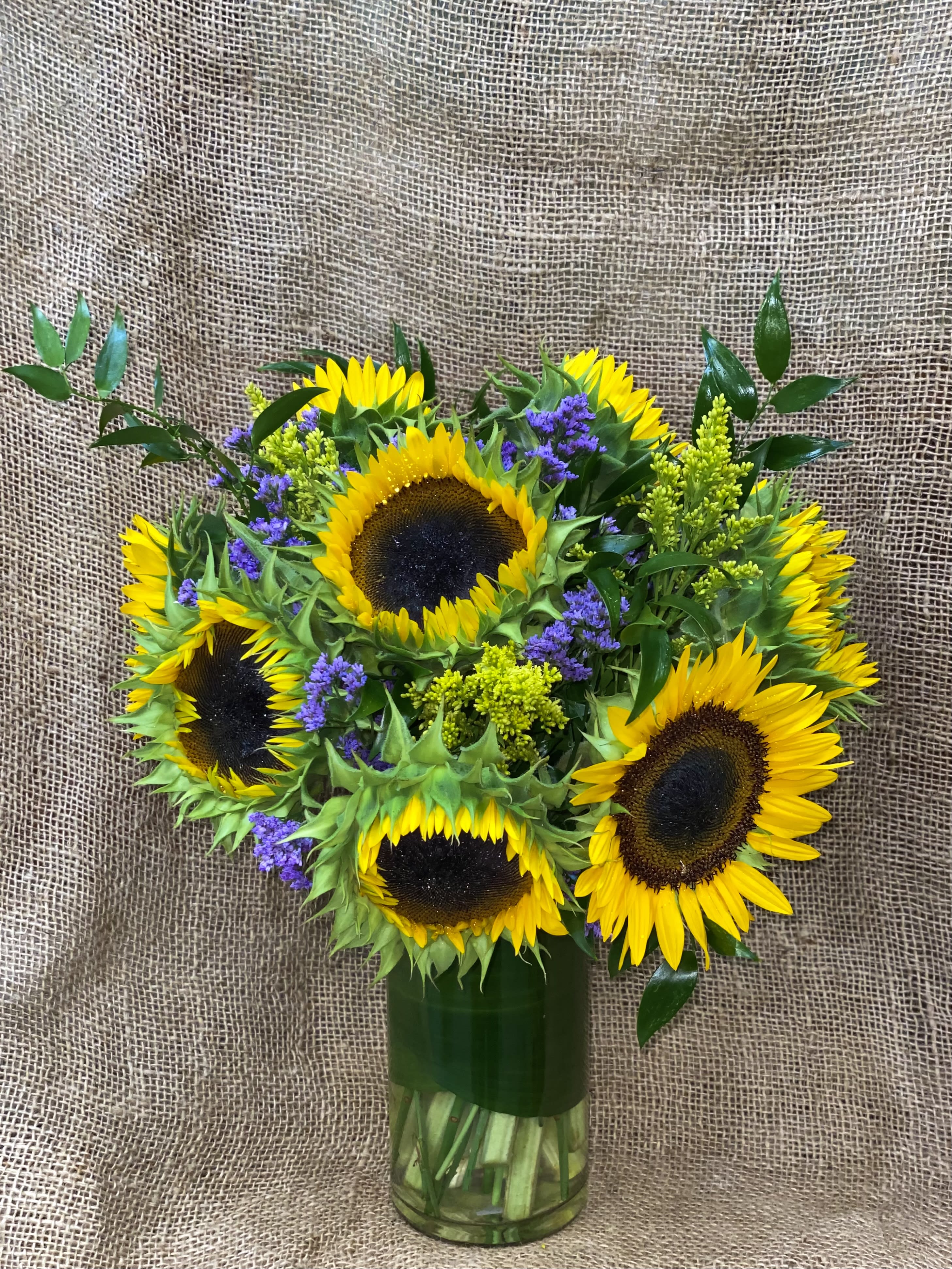 Snazzy Sunnies Snazzy Sunnies - Nothing lights up a room like the golden glow of sunny sunflowers, gathered up and presented in a big bouquet. Send this generous bunch to a special friend, and you’ll be sure to receive a cheerful thank you in return!