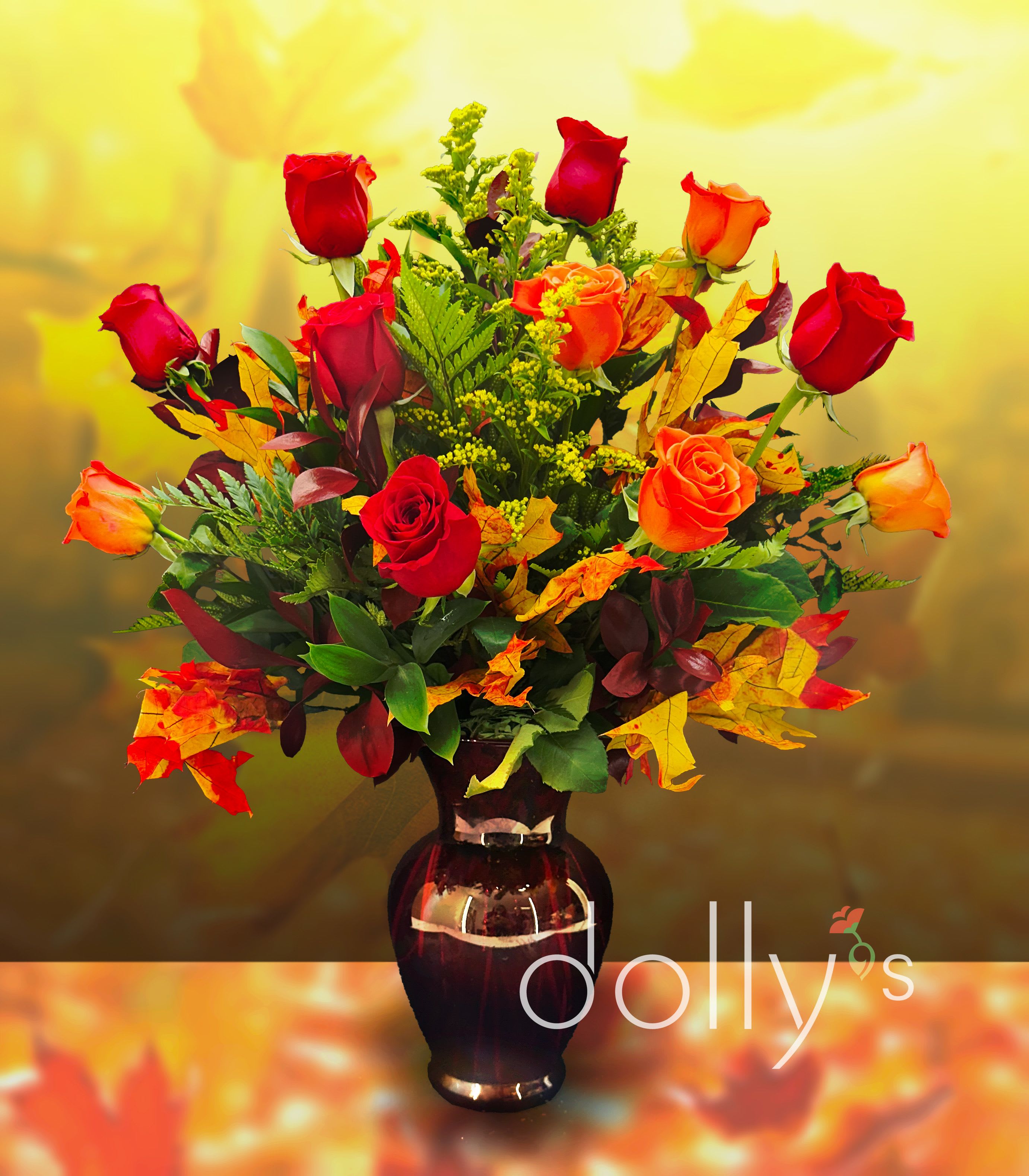 The Autumn Leaves The Autumn Leaves - A dozen mixed roses of red and orange hues, accented with decorative fall foliage and ruscus. "The falling leaves drift by the window, The autumn leaves of red and gold" - Nat King Cole, 1957