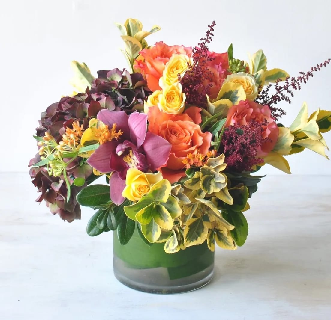Pumpkin Glow Pumpkin Glow - Bright and playful, full of fall splendor is our Pumpkin Glow arrangement! A sweet autumn arrangement with vibrant orange and pops of yellow.