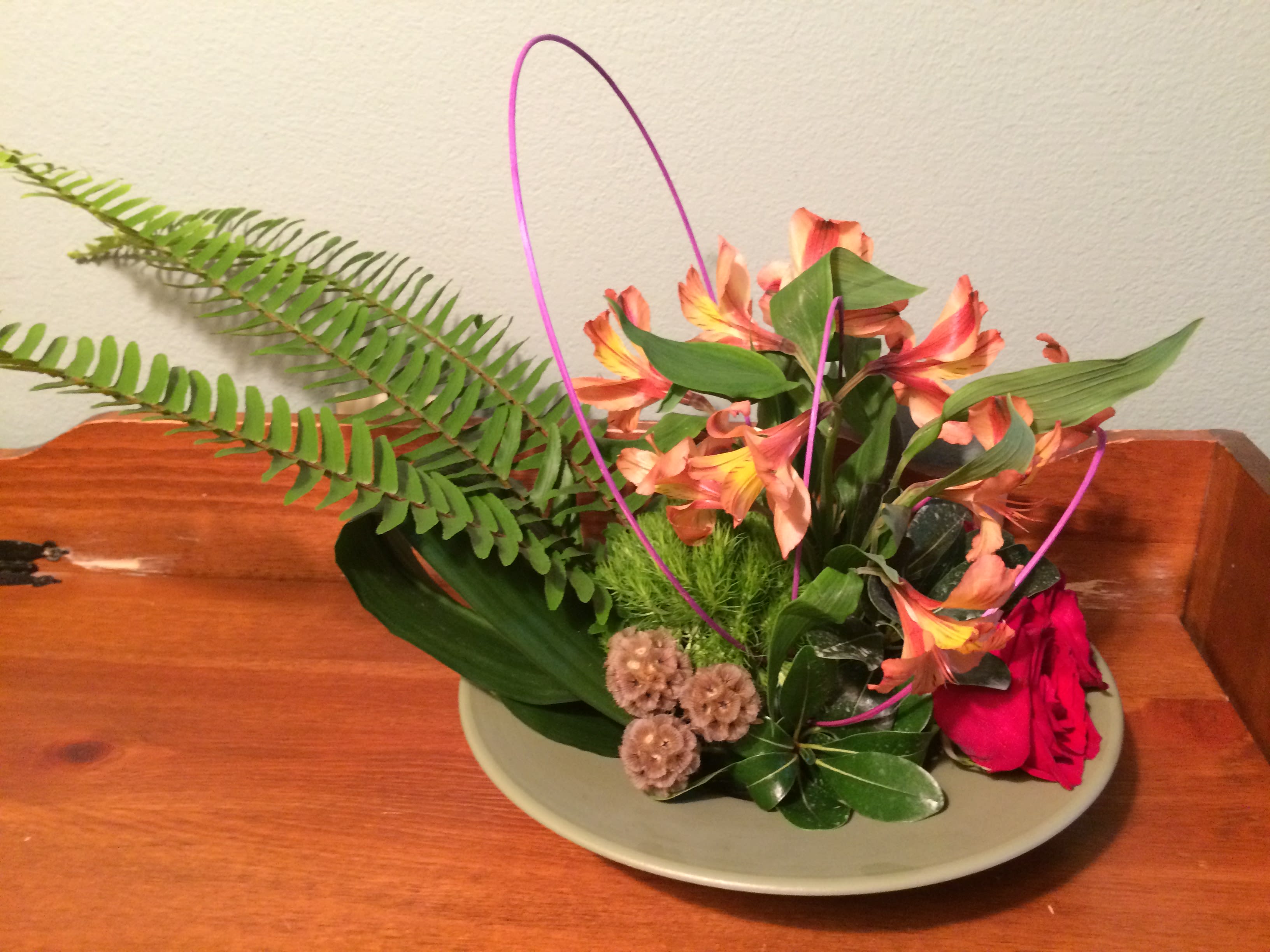 Autumn Wishes  - Autumn Wishes is created with a 11&quot; Wok shaped bowl with our freshest greens and our freshest flowers. Let our designer's WOW you with their creativity as they showcase their one-of-a-kind creations for your recipient. Our BloomSnap (picture) will show you what they have created, before it is delivered. Below's picture is an example. 