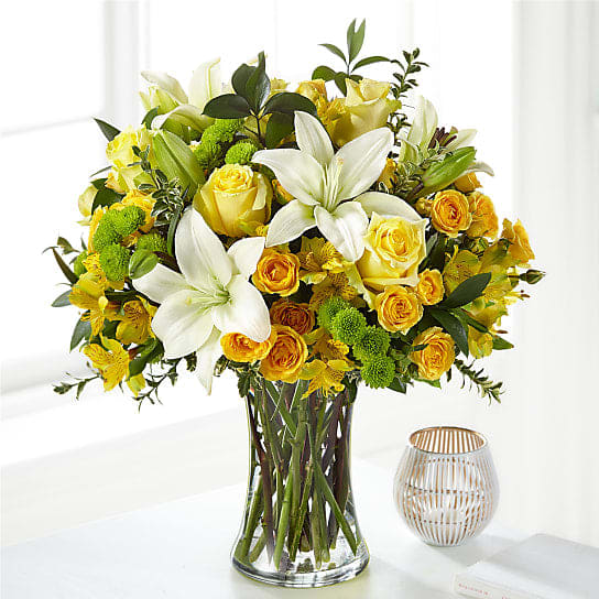 Hope And Serenity (BB) Hope And Serenity (BB) - Introducing the "Hope and Serenity" Thanksgiving Flower Arrangement, a stunning blend of yellow roses, white lilies, yellow mini spray roses, green poms, and yellow alstroemeria. This arrangement is designed to inspire feelings of hope, peace, and serenity during this special season of gratitude.