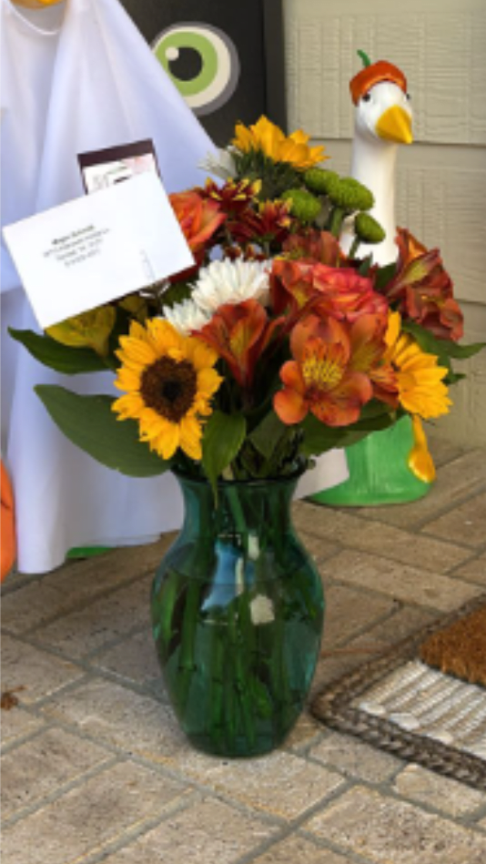 Autumn Special - A vibrant arrangement bursting with cheerful yellow and bold orange blooms, artfully accented with fresh greenery for a lively, uplifting display perfect for this fall!